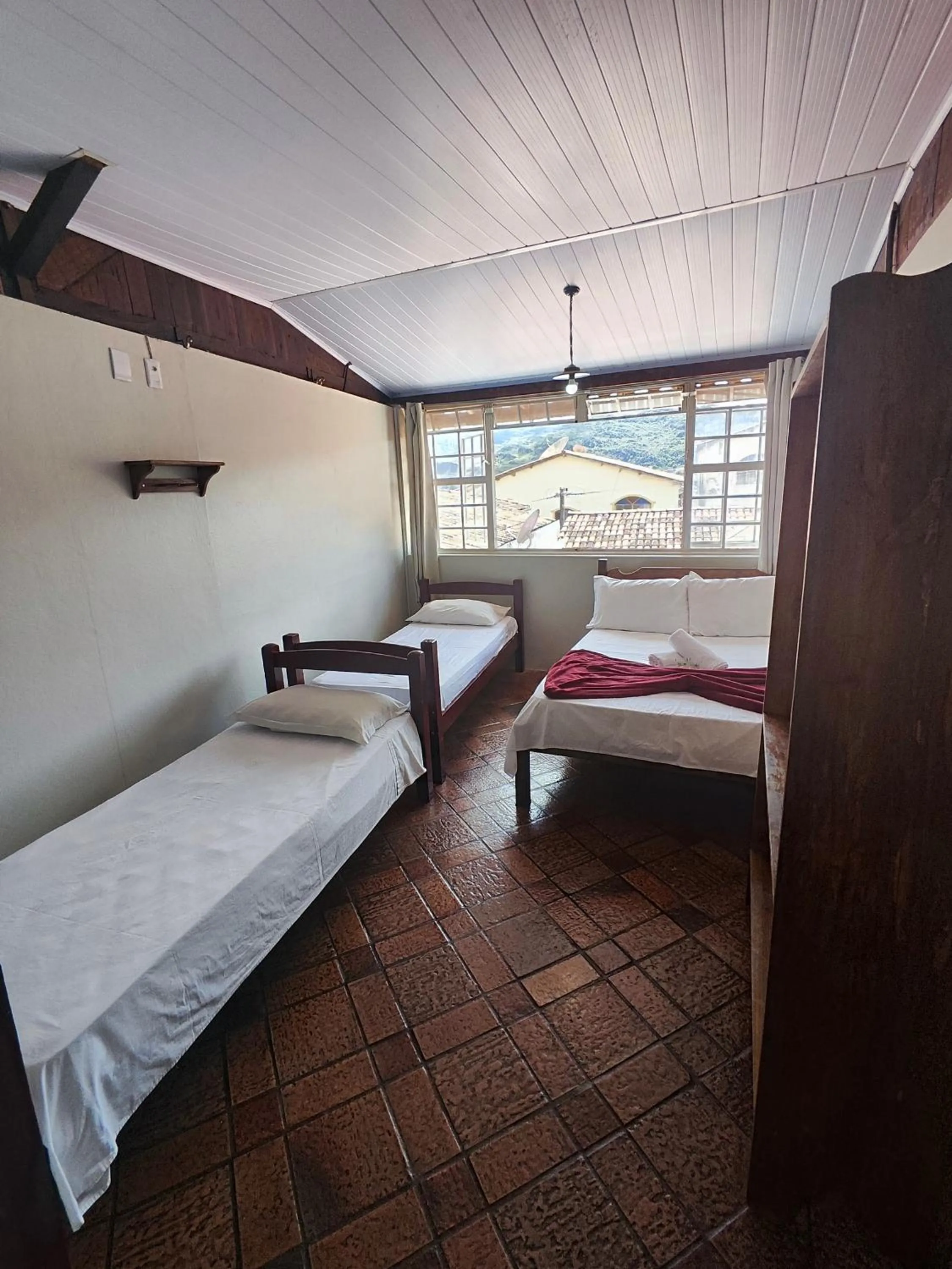 Bed in Pousada Acayaca