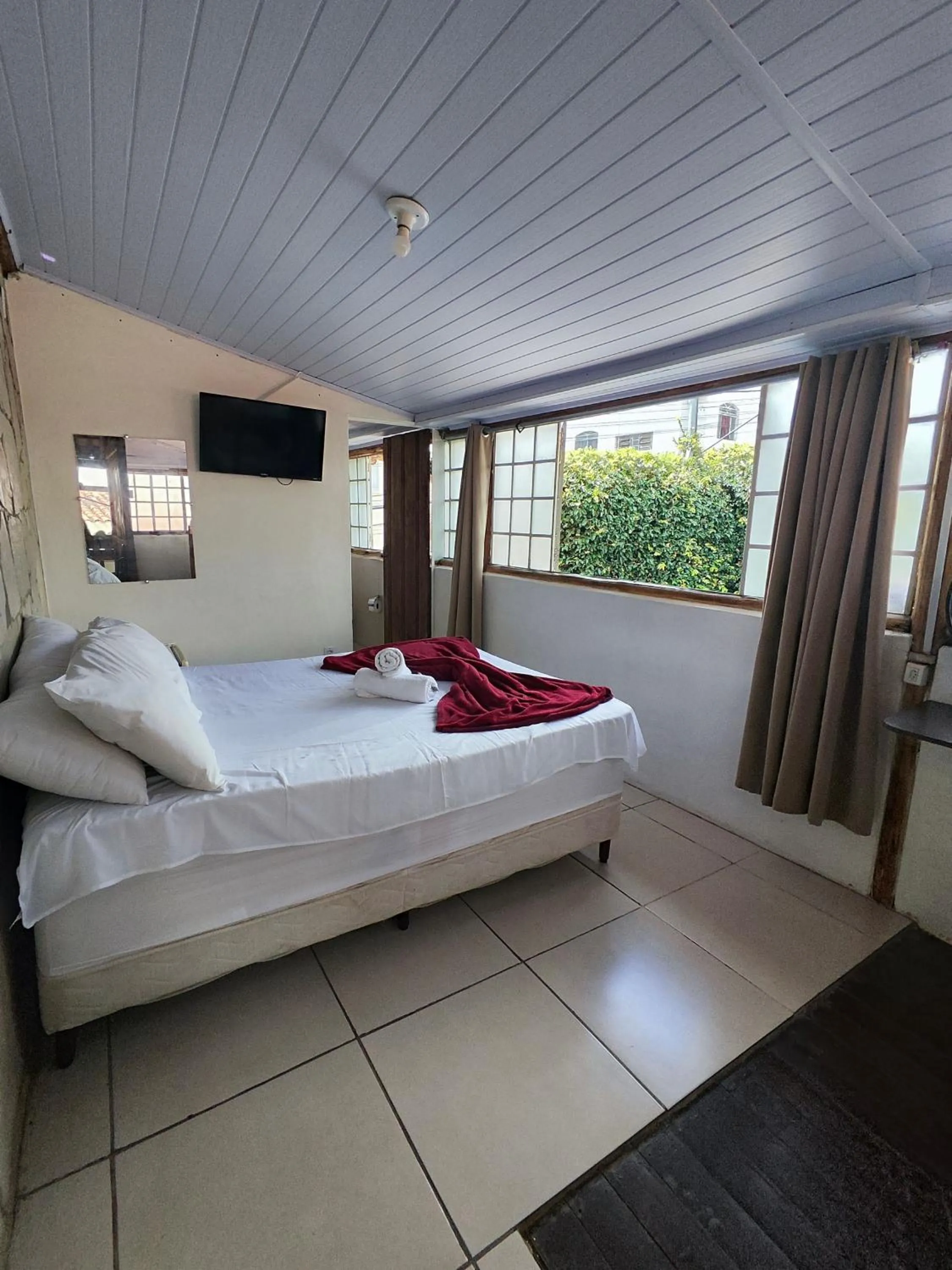 Bed in Pousada Acayaca