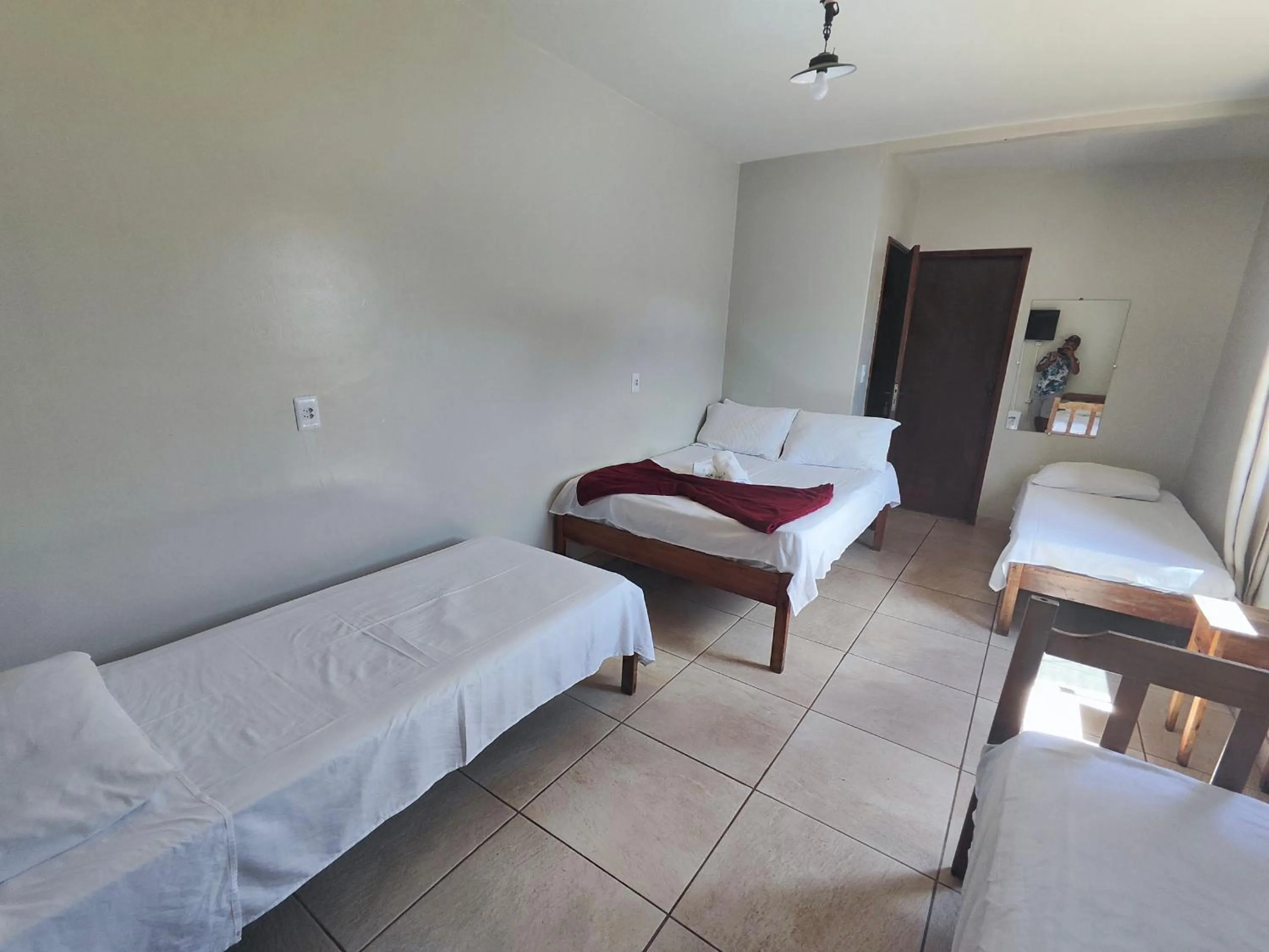 Bed in Pousada Acayaca