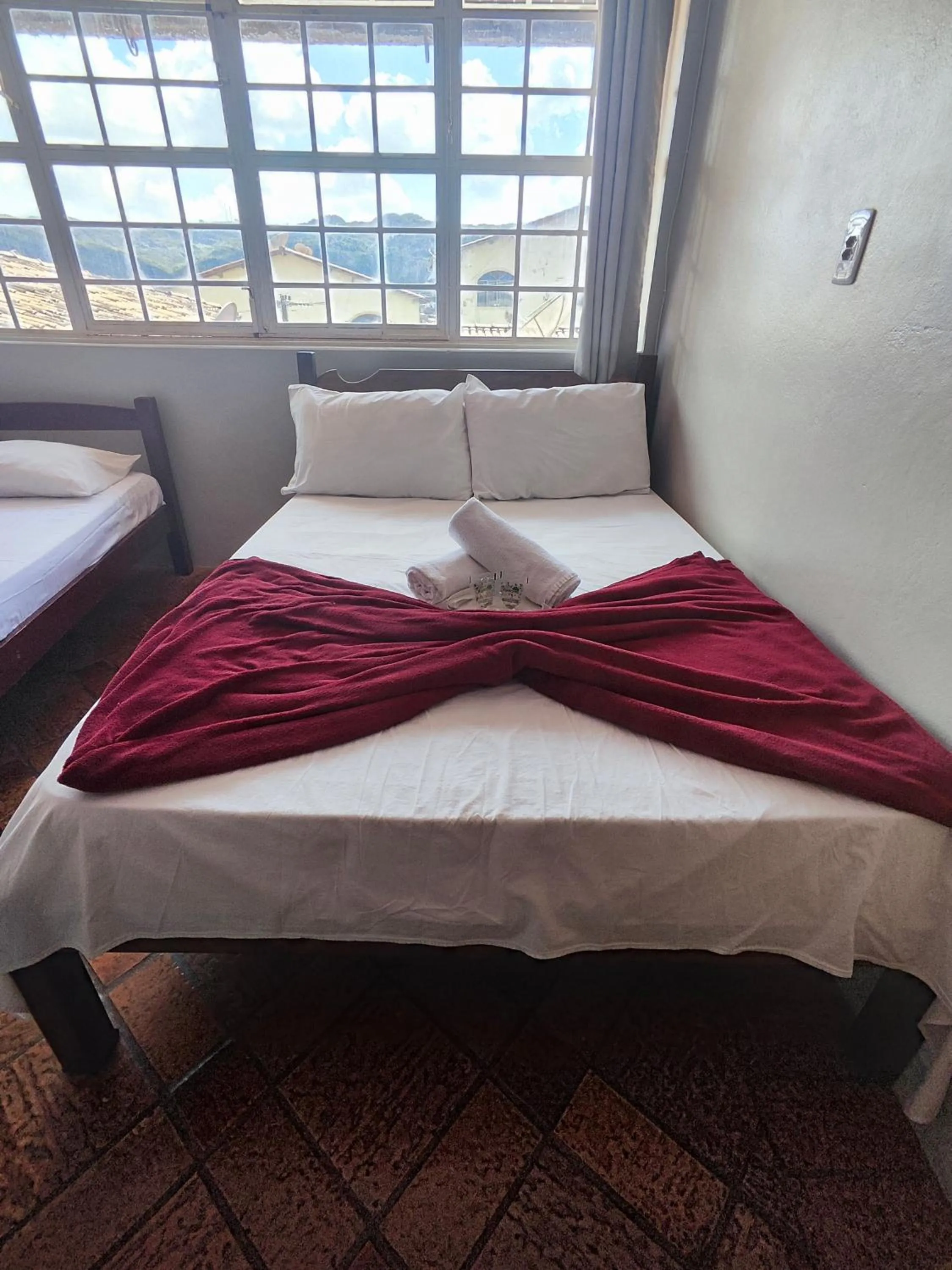 Bed in Pousada Acayaca