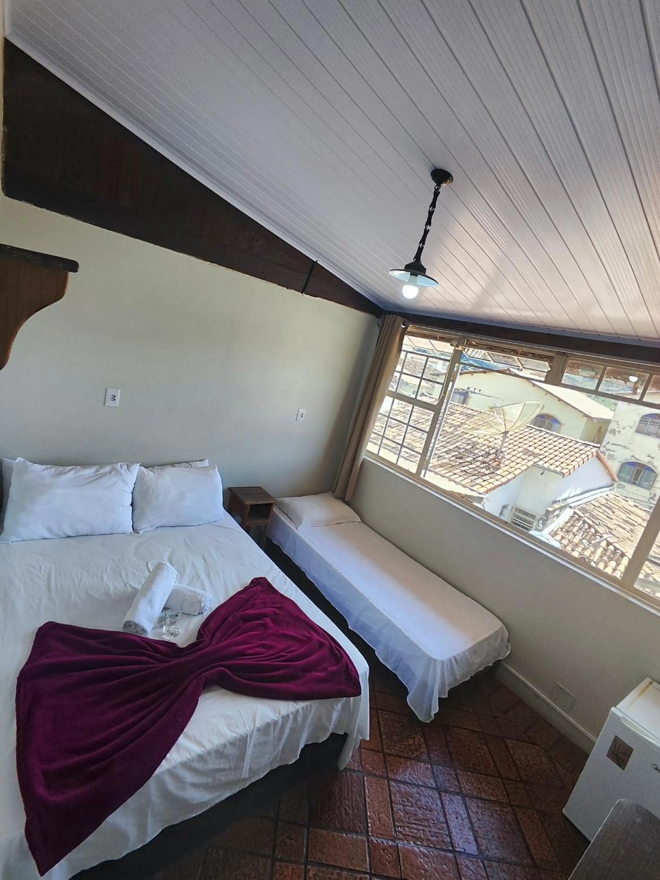 Bed in Pousada Acayaca