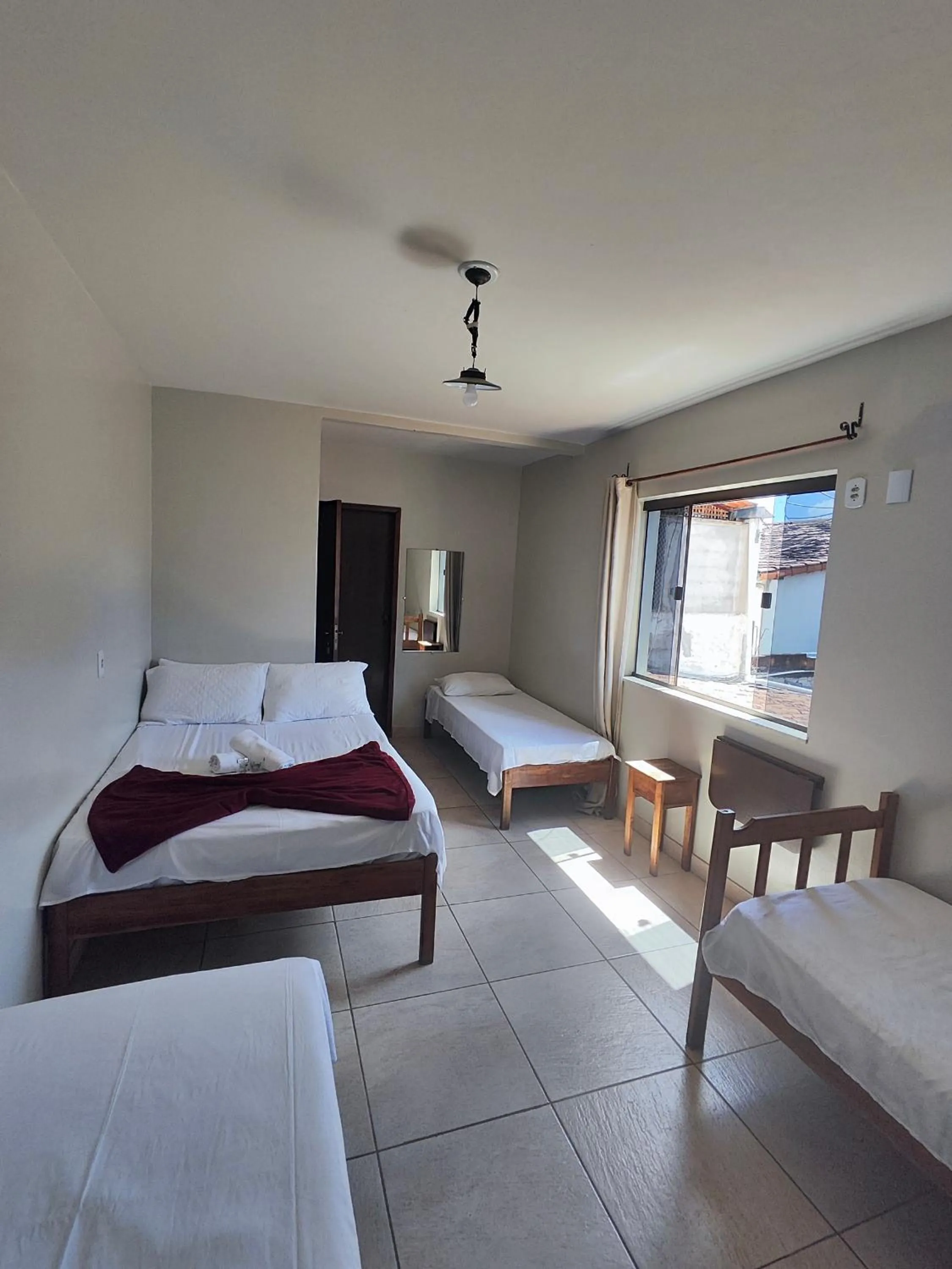 Bed in Pousada Acayaca