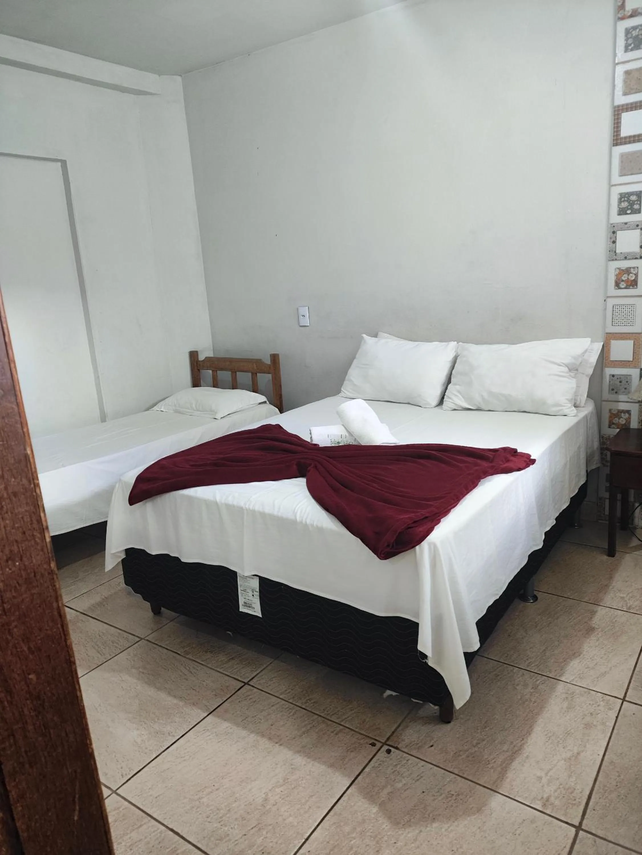 Bed in Pousada Acayaca