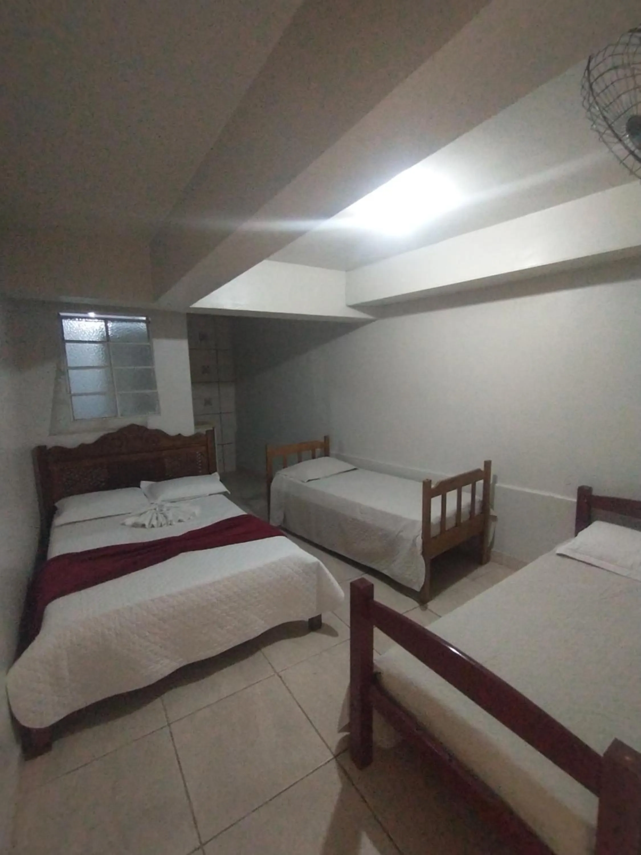 Bed in Pousada Acayaca