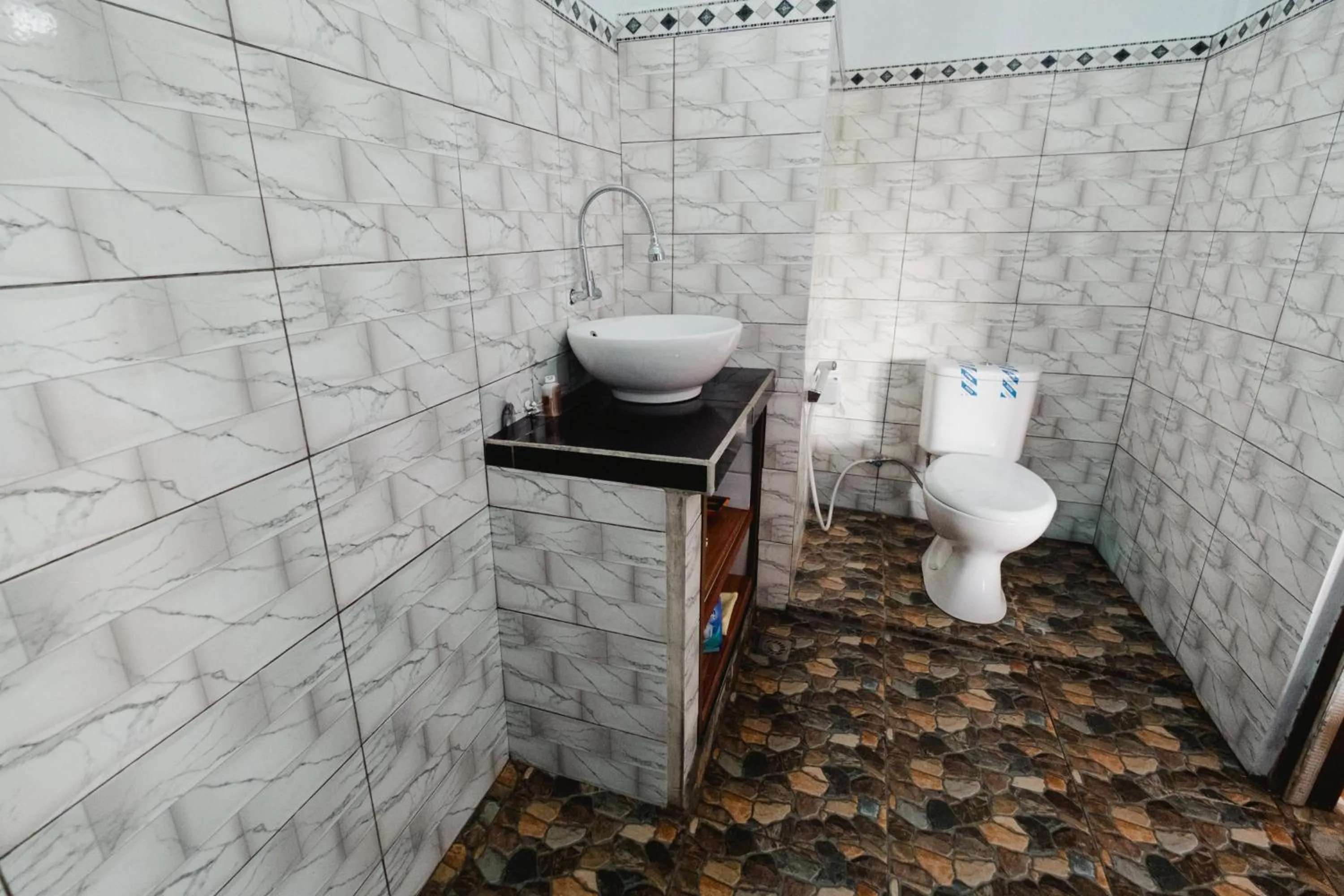 Bathroom in Rizky Guesthouse