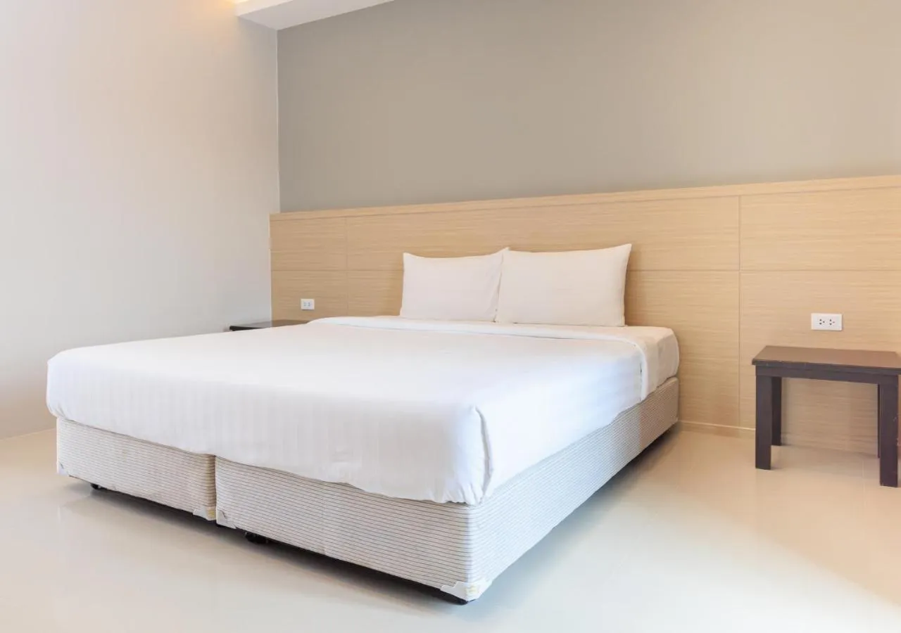 Bed in Baan Phor Phan Hotel