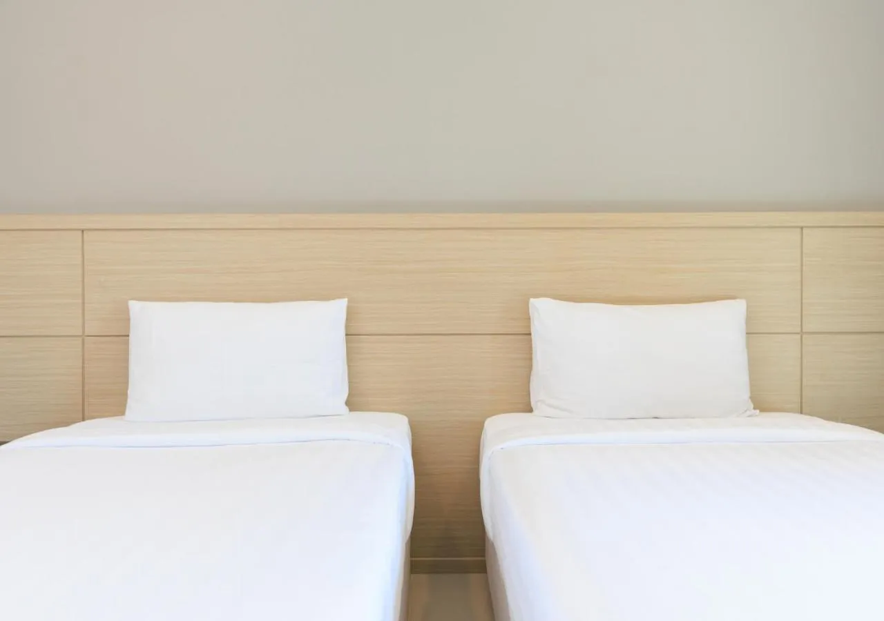 Bed in Baan Phor Phan Hotel