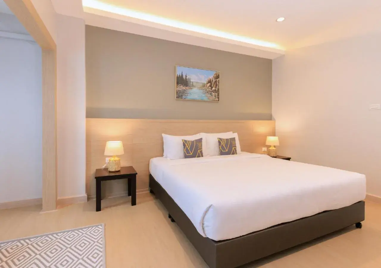 Bed in Baan Phor Phan Hotel Bed in Baan Phor Phan Hotel