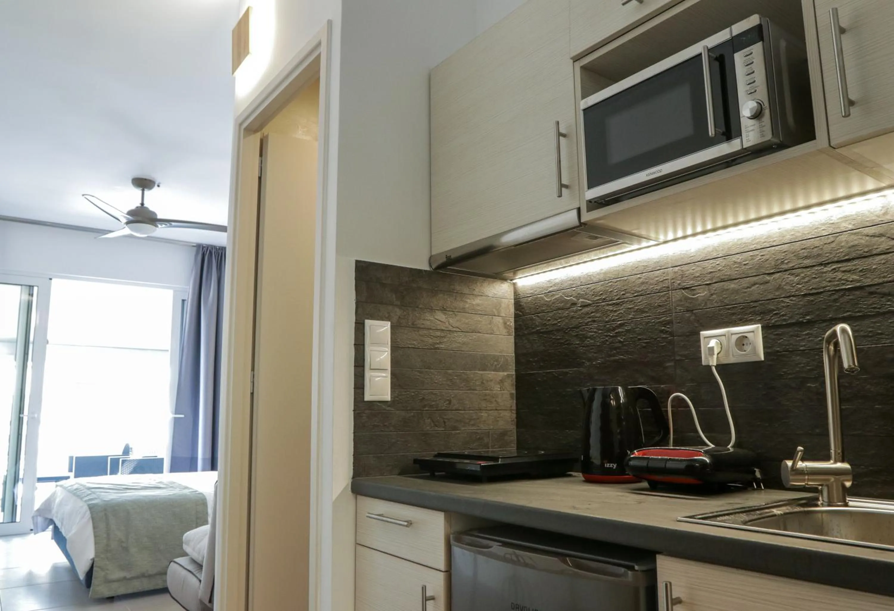 Kitchen or kitchenette in V36 Suites