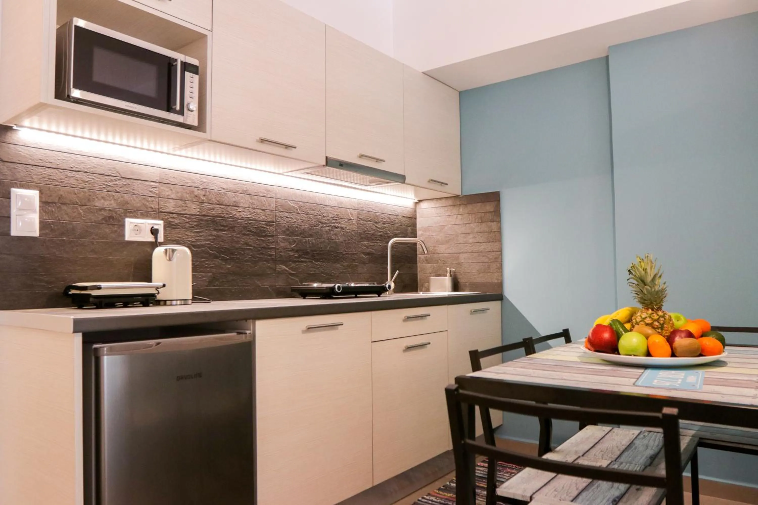 Kitchen or kitchenette in V36 Suites