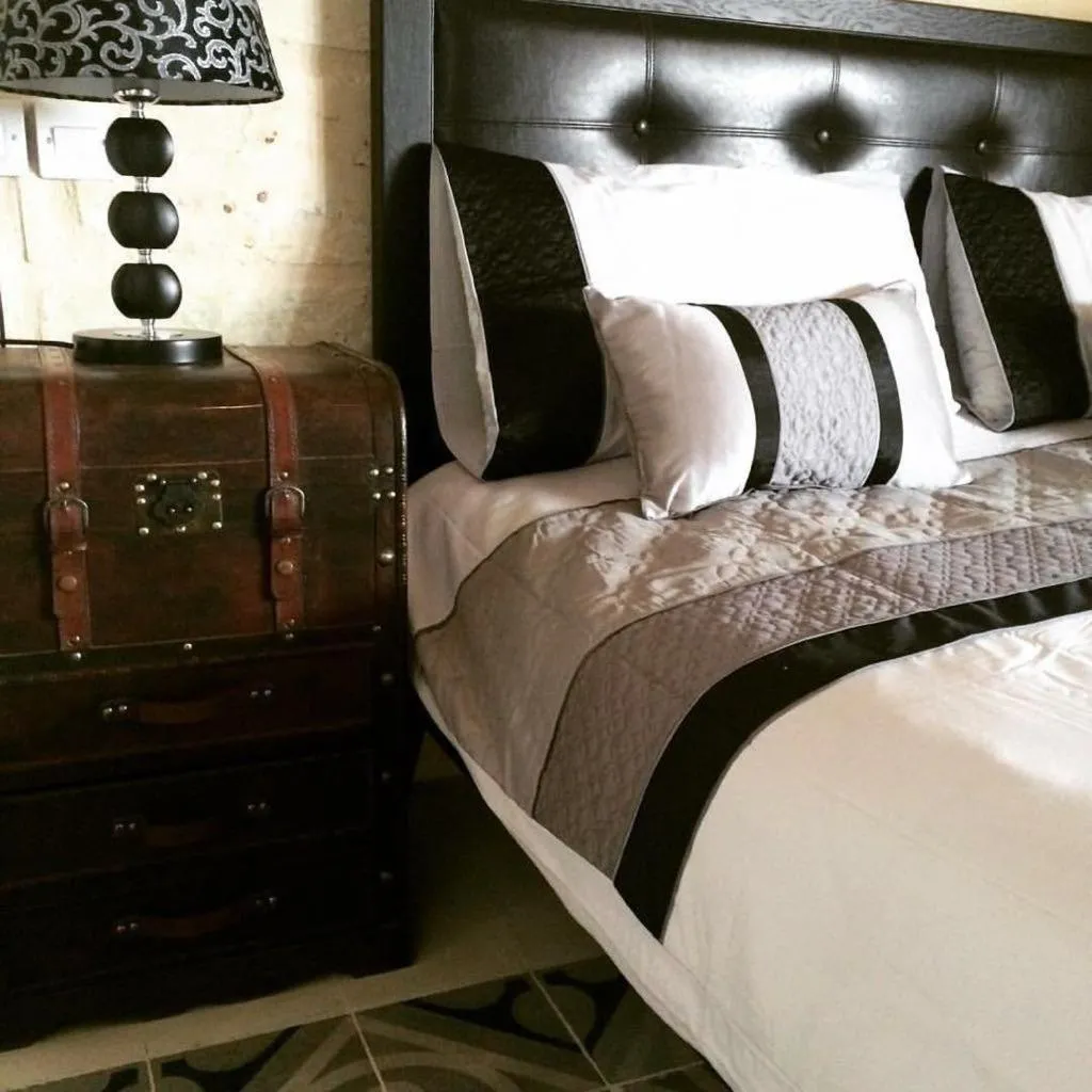 Decorative detail, Bed in Luciano Al Porto Boutique