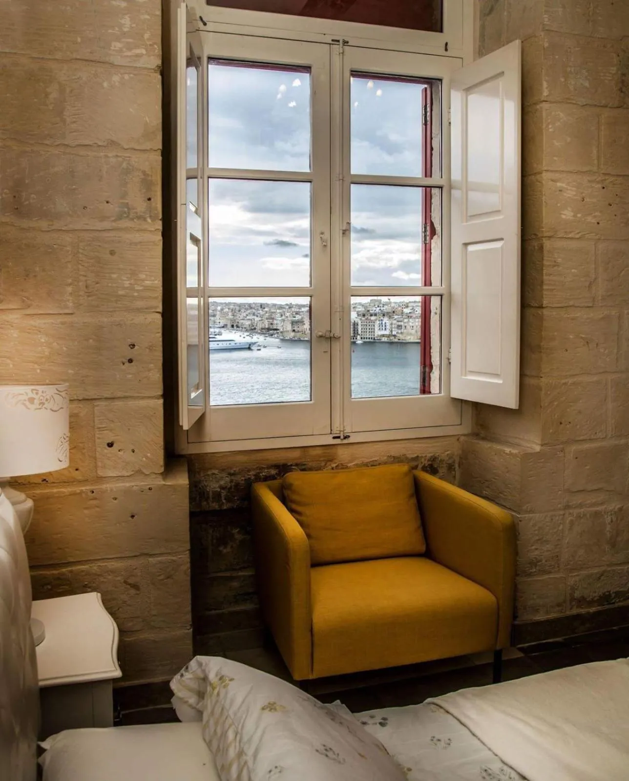 Seating area, Bed in Luciano Al Porto Boutique