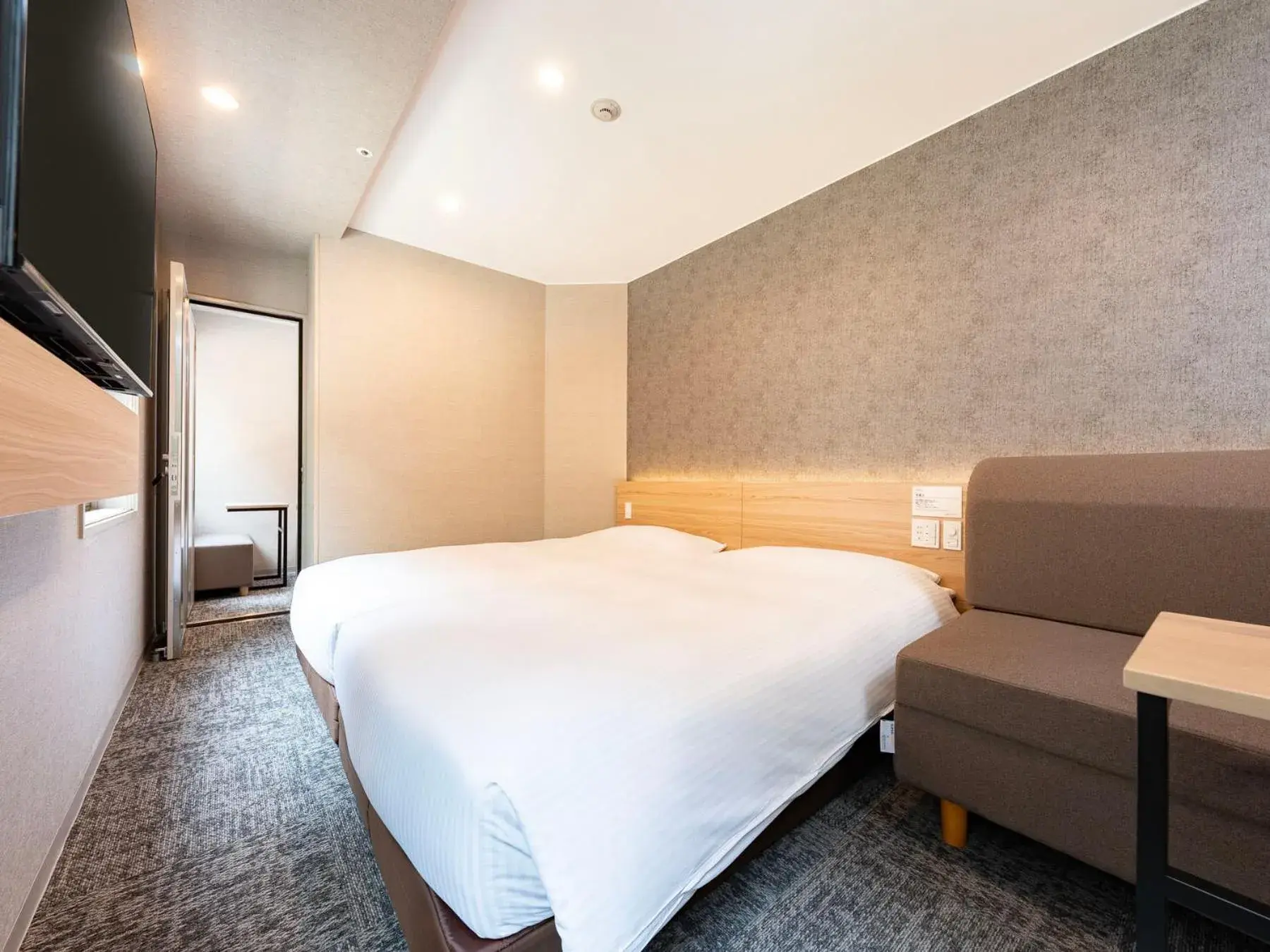 Bed in Super Hotel Premier Tokyo Station Yaesu-Chuoguchi Bed in Super Hotel Premier Tokyo Station Yaesu-Chuoguchi