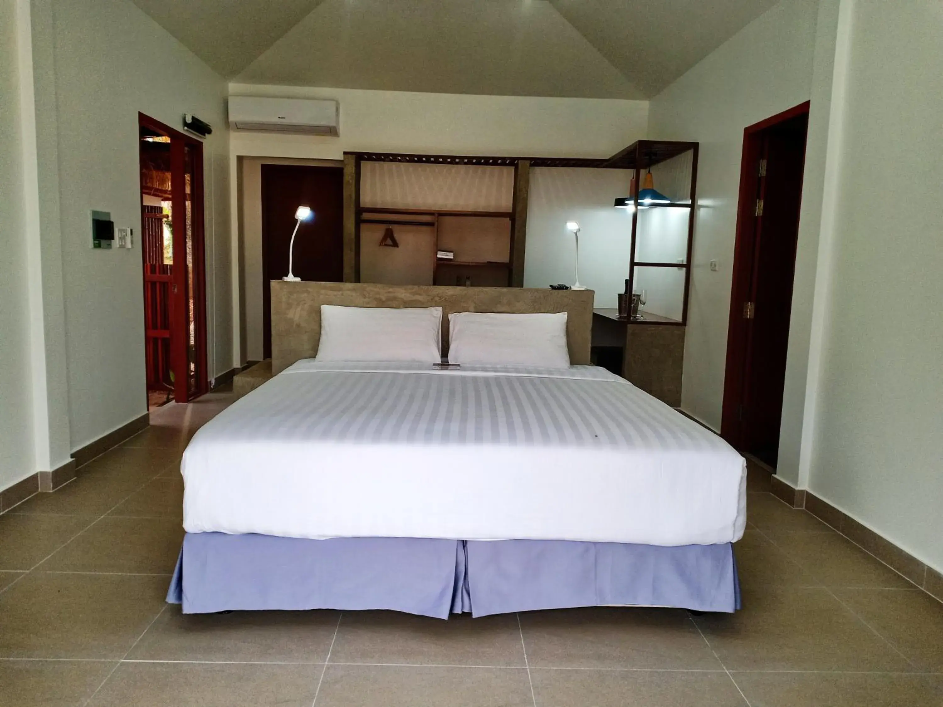 Bed in The Sanctuary Nam Ngum Beach Resort Bed in The Sanctuary Nam Ngum Beach Resort