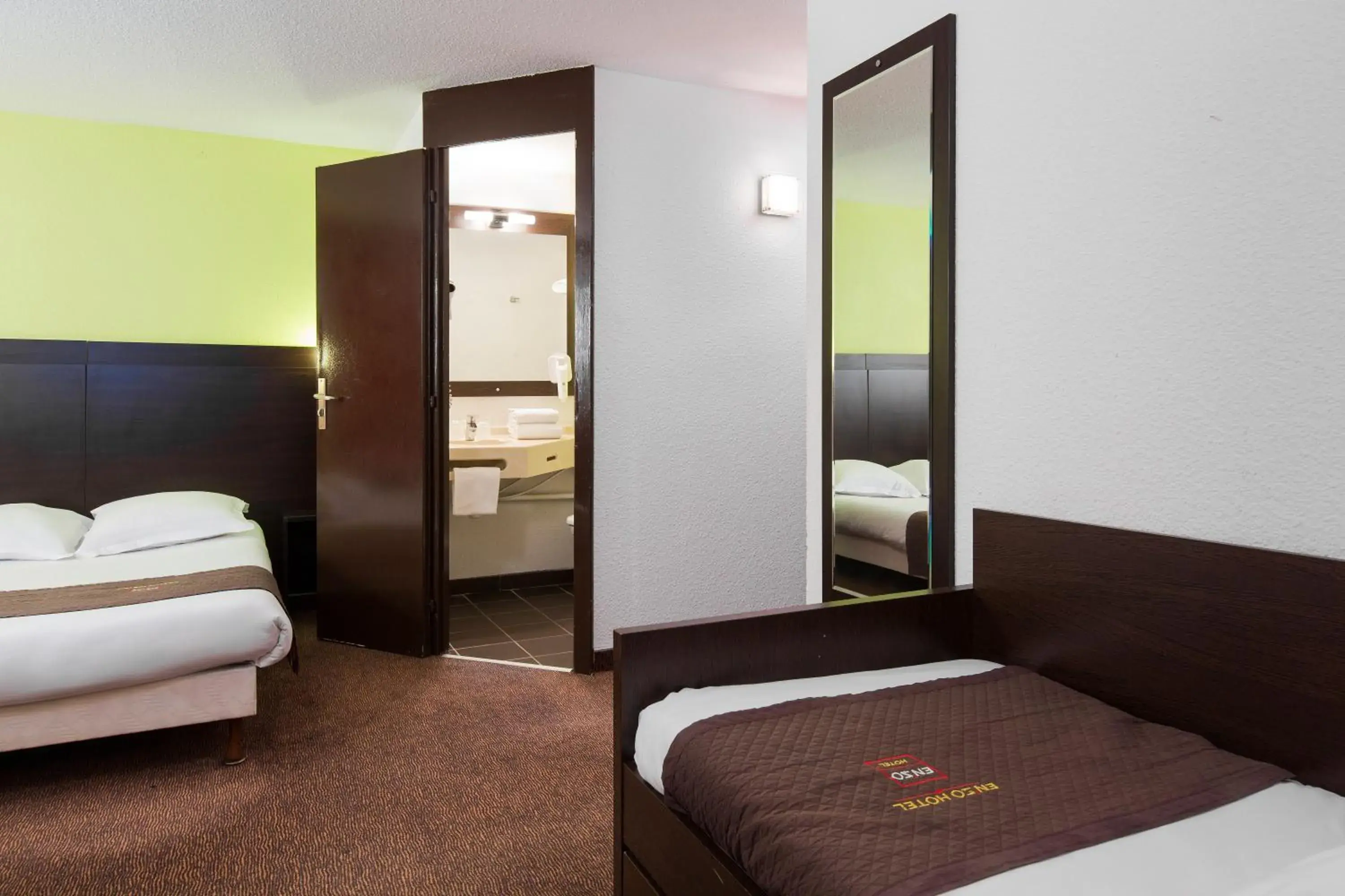 Bed in Enzo Hotels Pont-a-Mousson by Kyriad Direct Bed in Enzo Hotels Pont-a-Mousson by Kyriad Direct