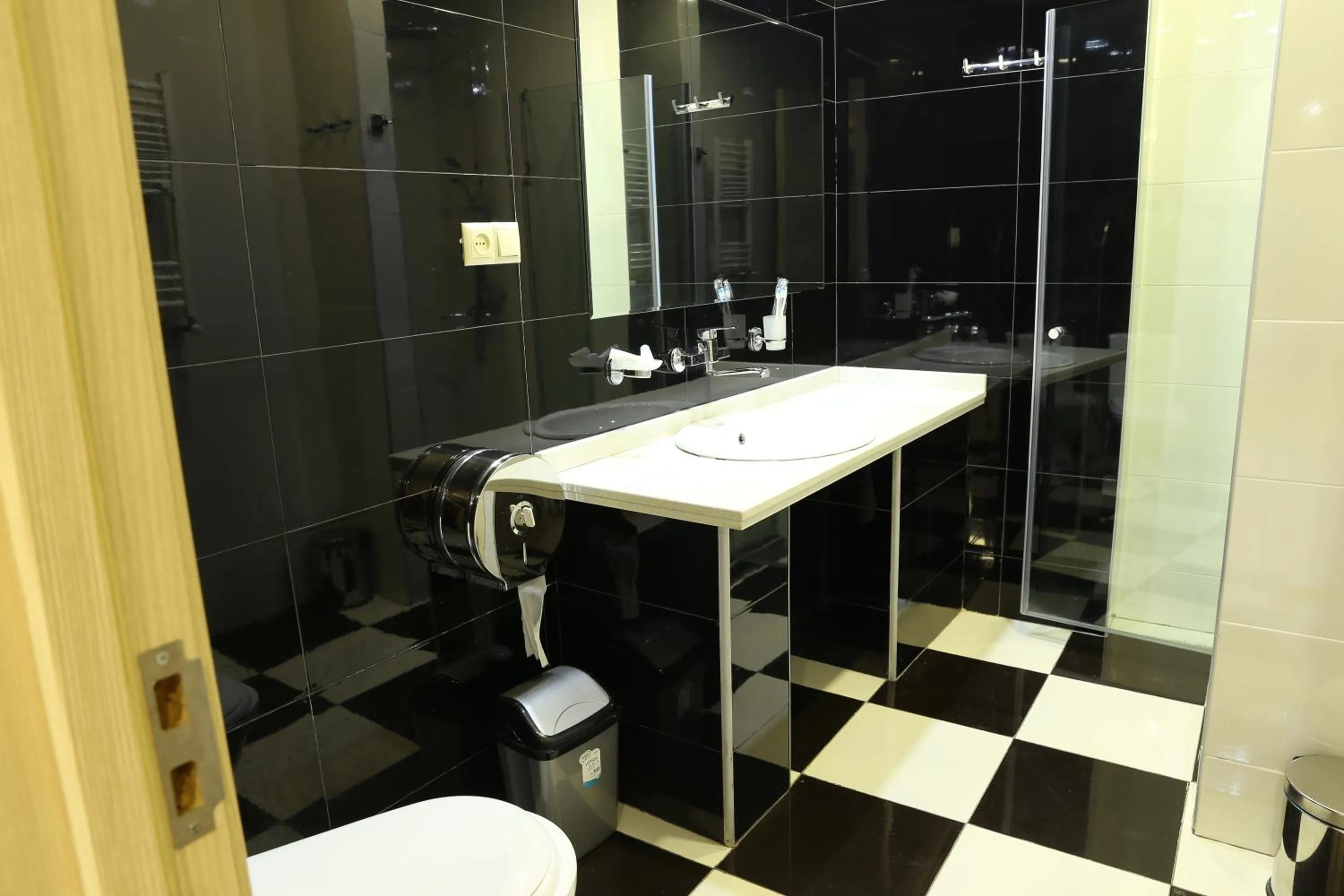 Bathroom in Dkd-bridge Hotel