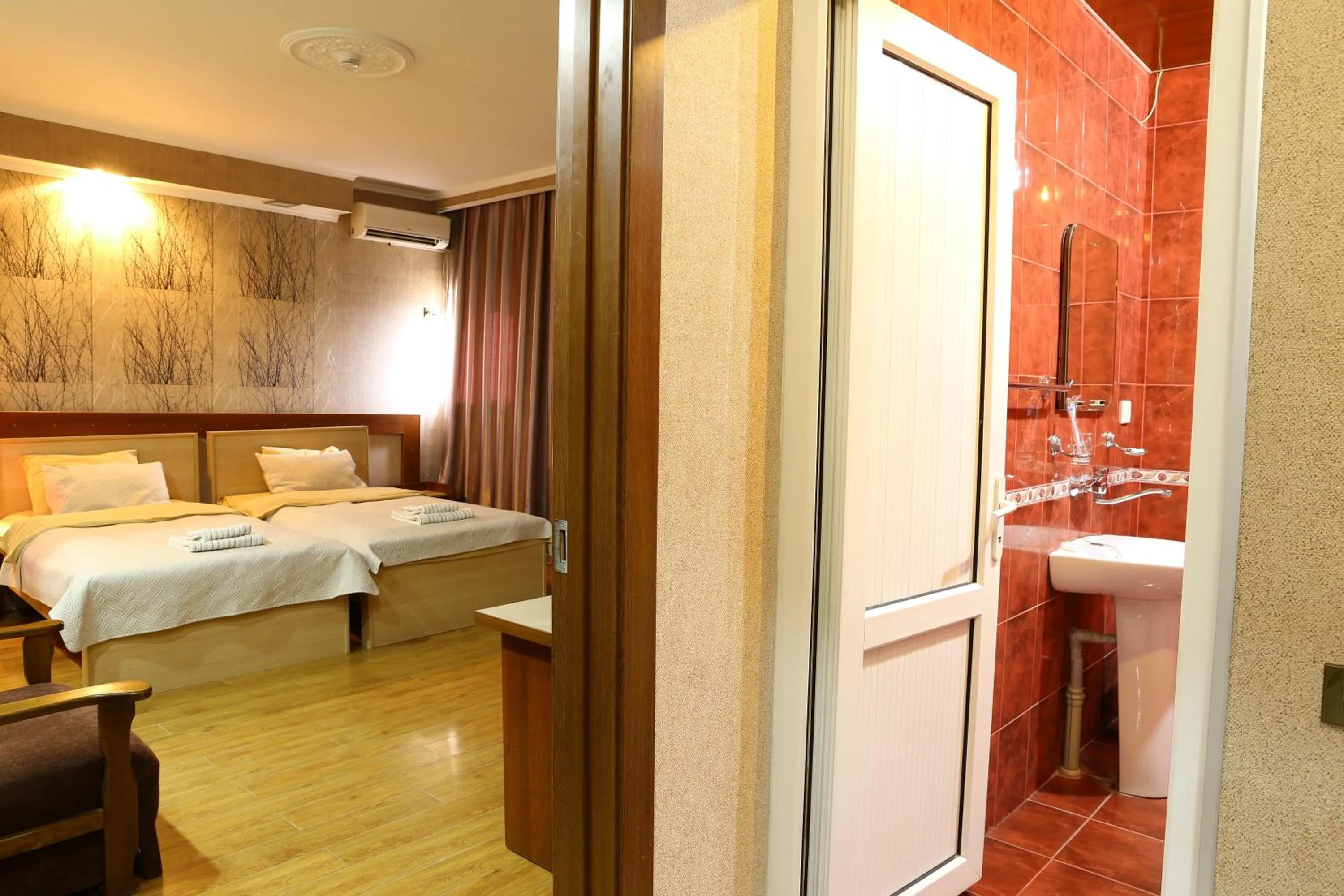 Bathroom, Bed in Dkd-bridge Hotel