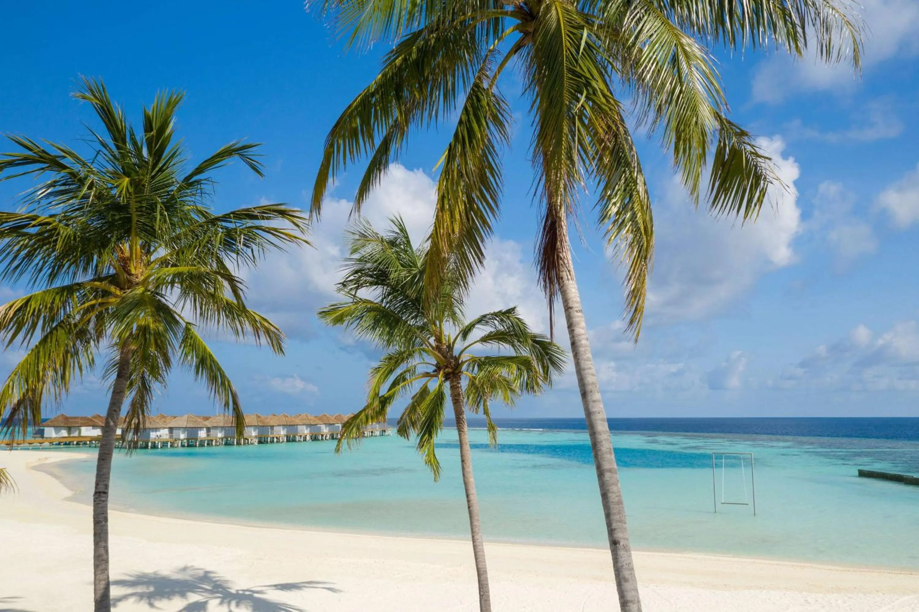 Beach in OUTRIGGER Maldives Maafushivaru Resort - 25 percent discount on transfers for min 4 nights stay and more, valid for reservations between 01 July till 22 Dec 2025