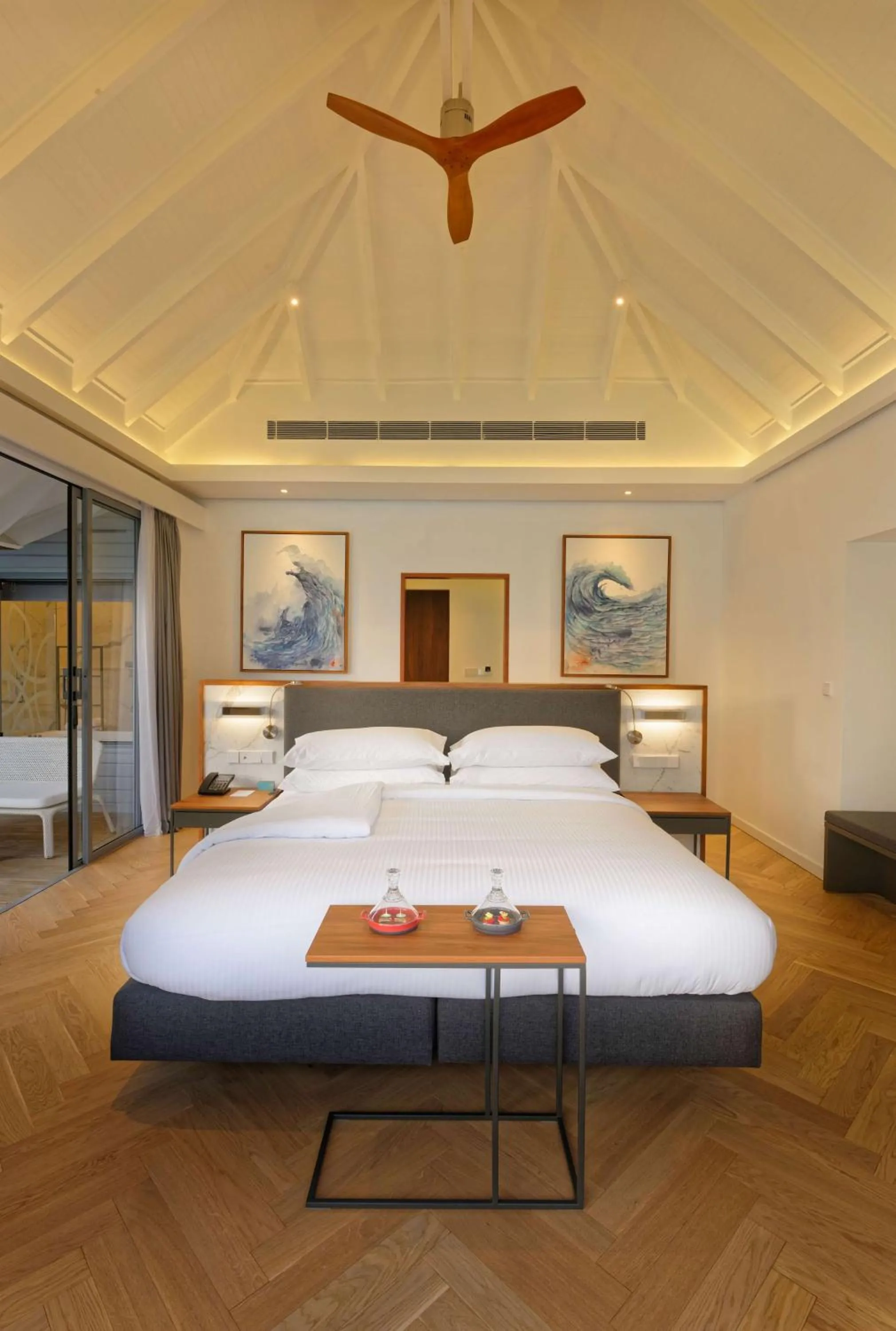 Photo of the whole room, Bed in OUTRIGGER Maldives Maafushivaru Resort - 25 percent discount on transfers for min 4 nights stay and more, valid for reservations between 01 July till 22 Dec 2025