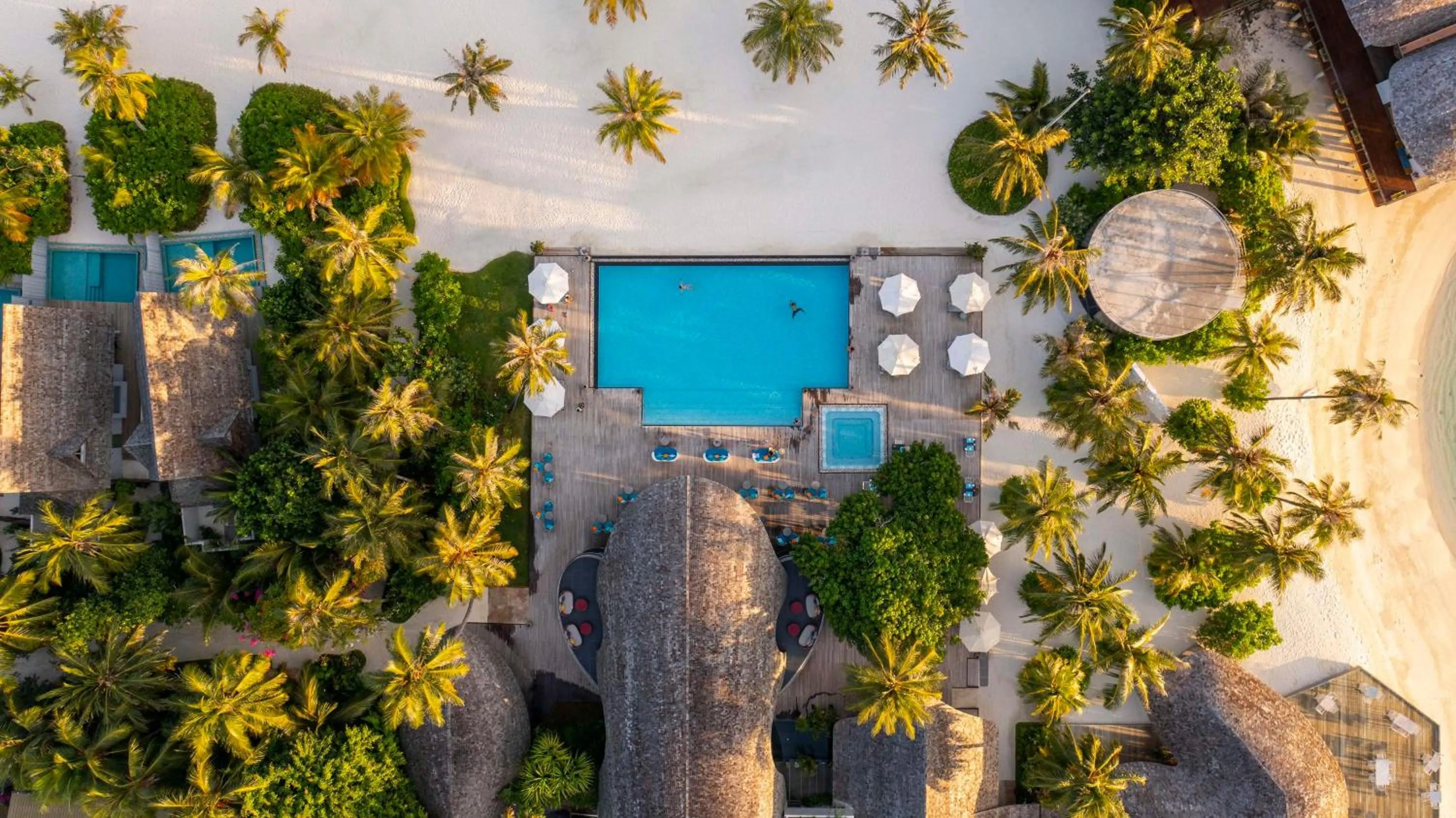 Property building in OUTRIGGER Maldives Maafushivaru Resort - 25 percent discount on transfers for min 4 nights stay and more, valid for reservations between 01 July till 22 Dec 2025