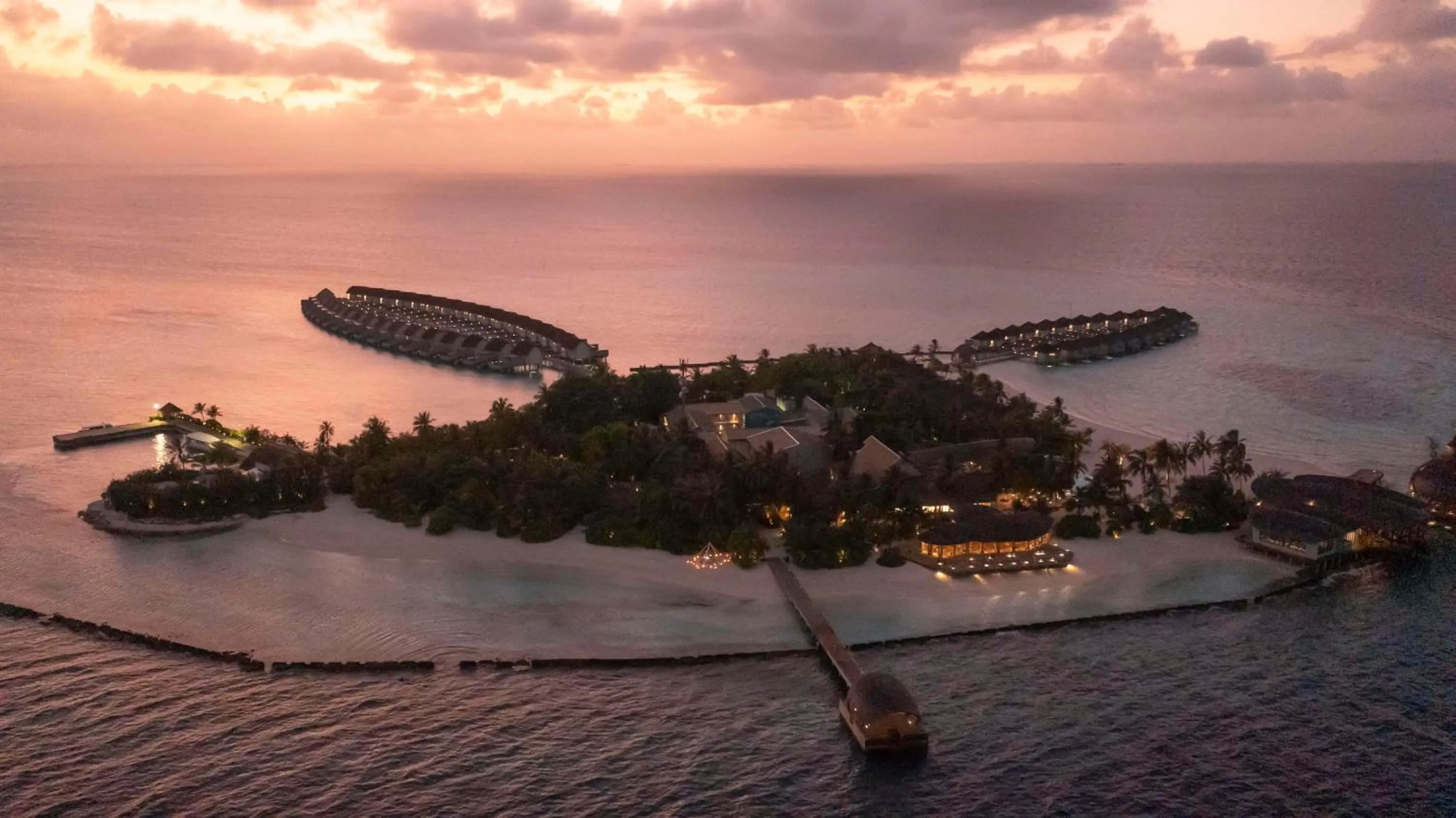 Property building in OUTRIGGER Maldives Maafushivaru Resort - 25 percent discount on transfers for min 4 nights stay and more, valid for reservations between 01 July till 22 Dec 2025