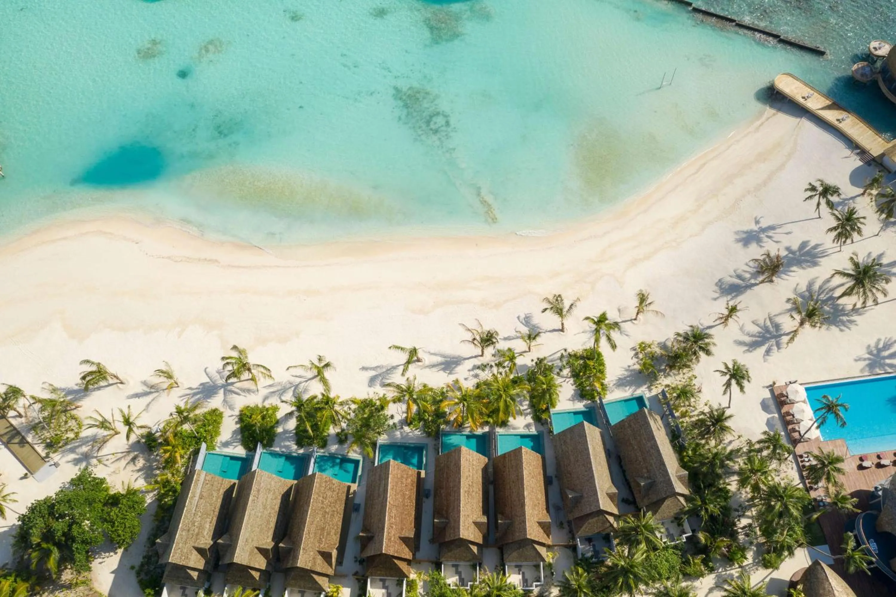 Property building in OUTRIGGER Maldives Maafushivaru Resort - 25 percent discount on transfers for min 4 nights stay and more, valid for reservations between 01 July till 22 Dec 2025