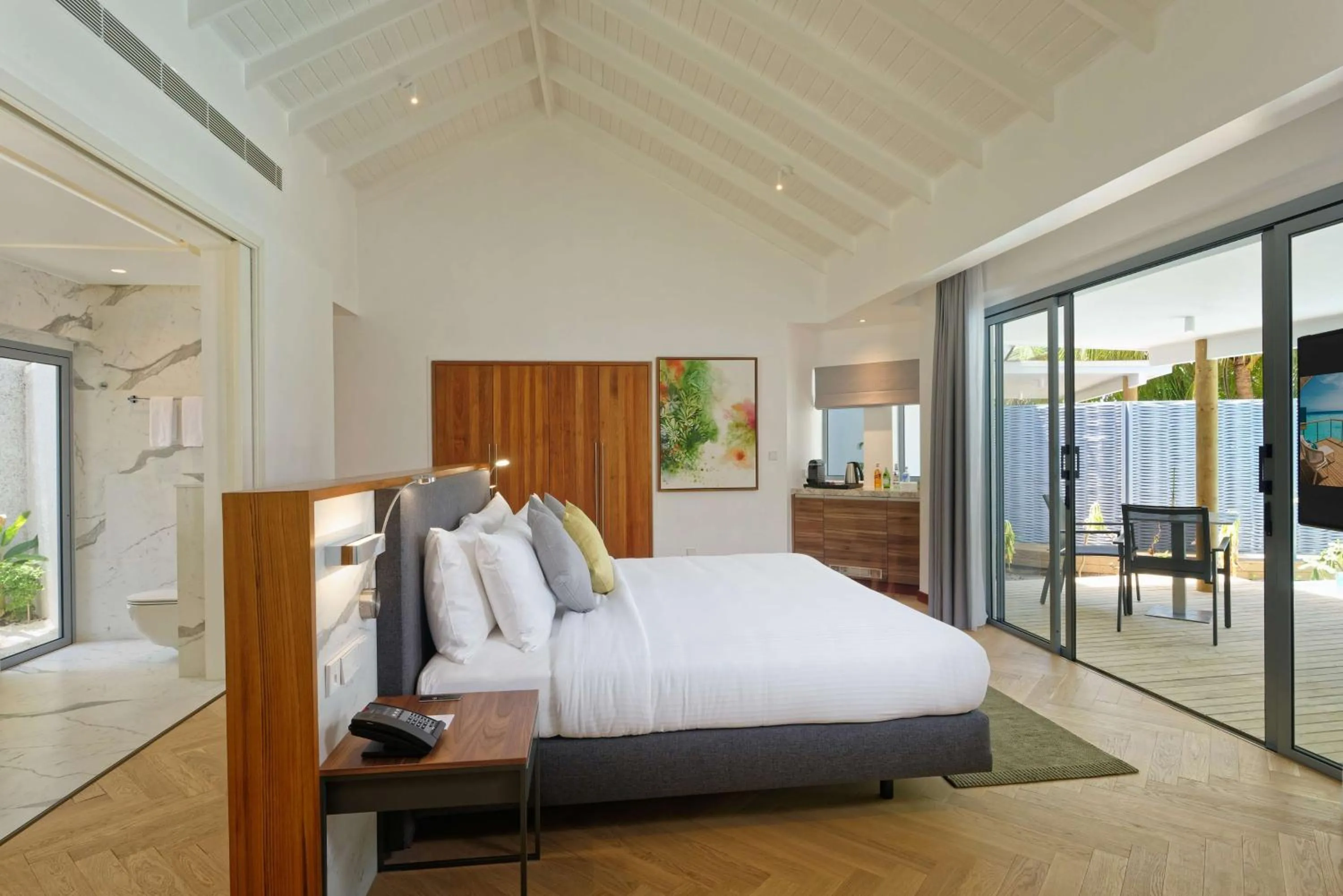 Photo of the whole room, Bed in OUTRIGGER Maldives Maafushivaru Resort - 25 percent discount on transfers for min 4 nights stay and more, valid for reservations between 01 July till 22 Dec 2025