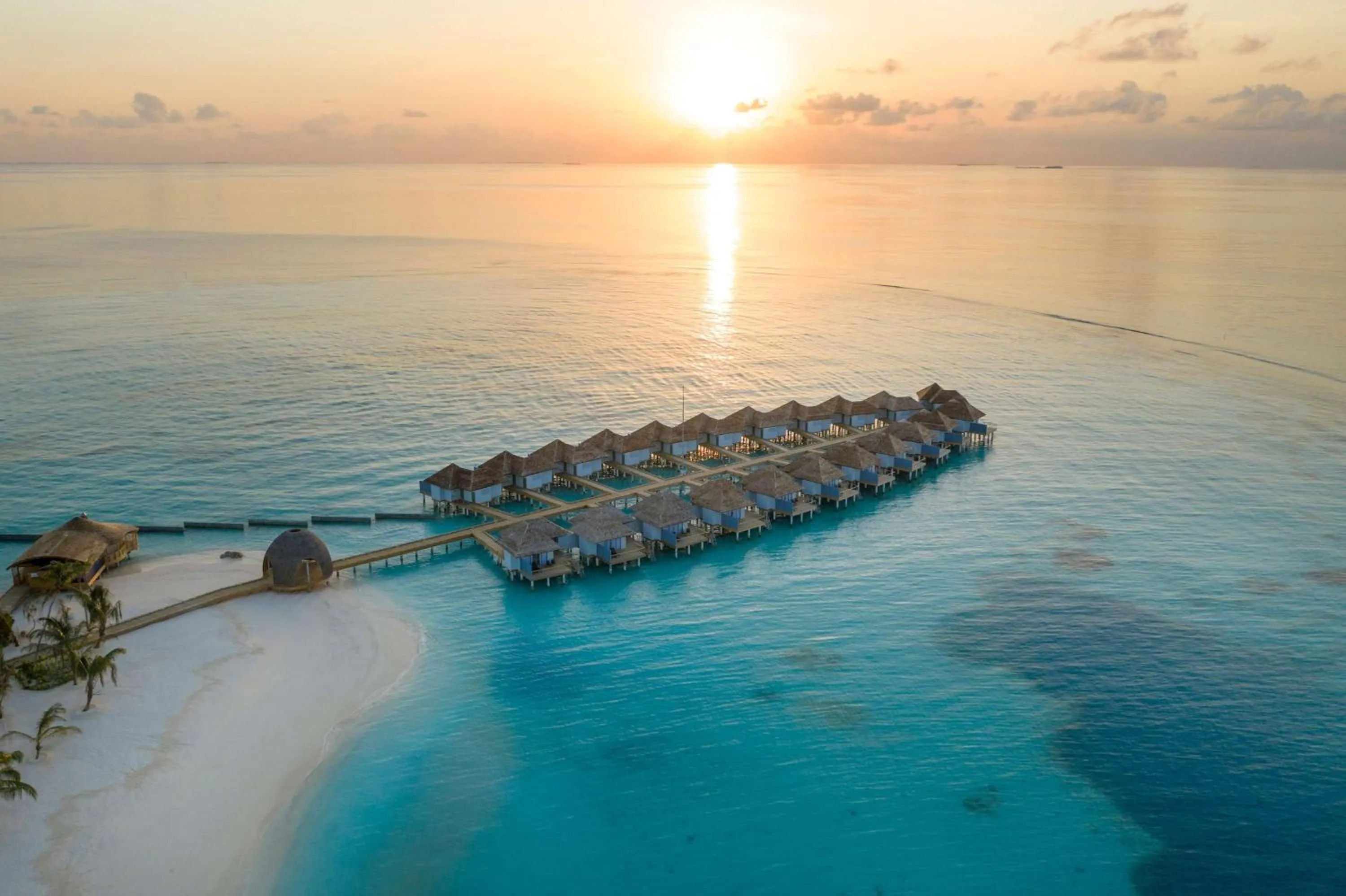 Property building in OUTRIGGER Maldives Maafushivaru Resort - 25 percent discount on transfers for min 4 nights stay and more, valid for reservations between 01 July till 22 Dec 2025