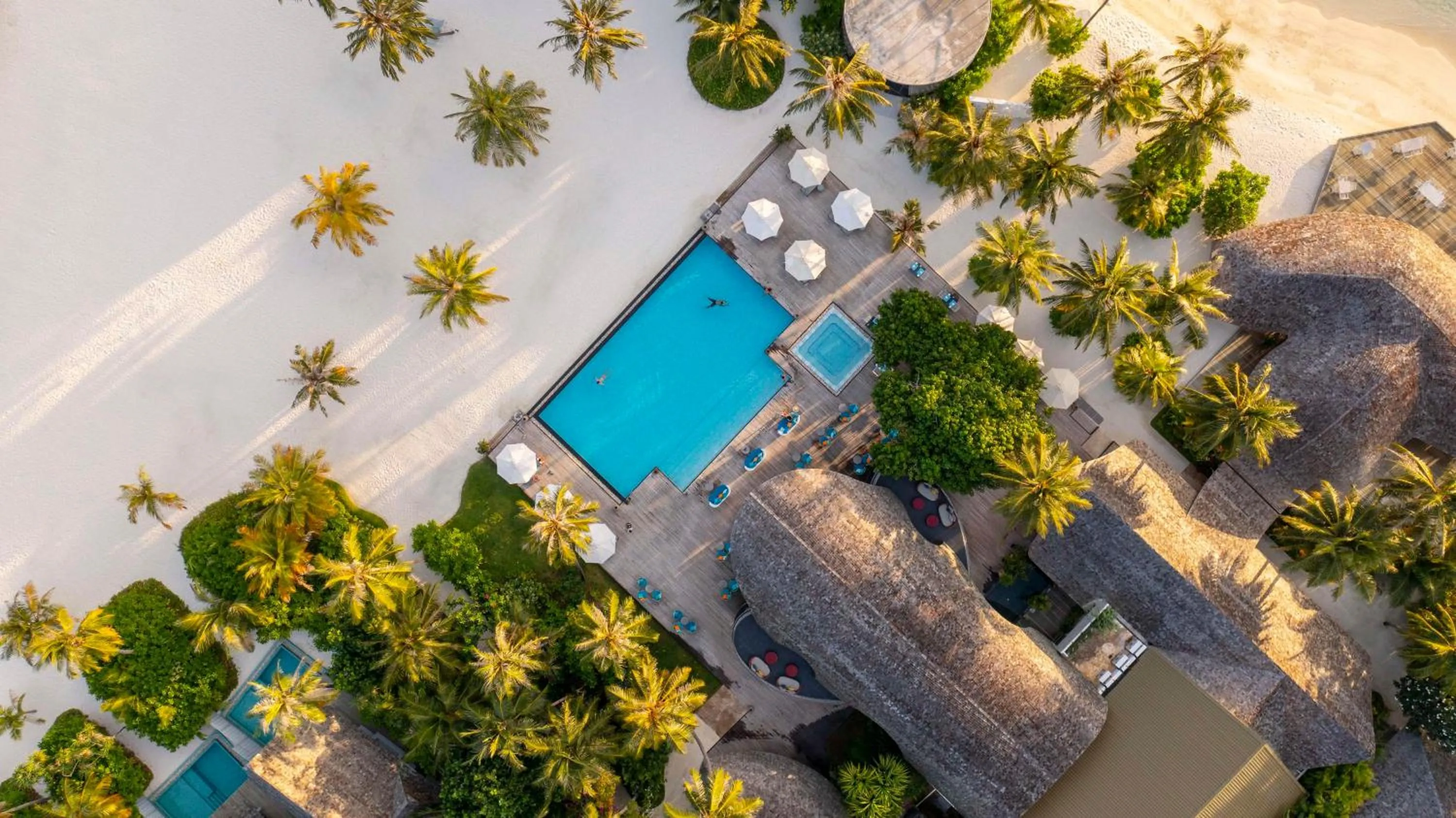 Property building in OUTRIGGER Maldives Maafushivaru Resort - 25 percent discount on transfers for min 4 nights stay and more, valid for reservations between 01 July till 22 Dec 2025