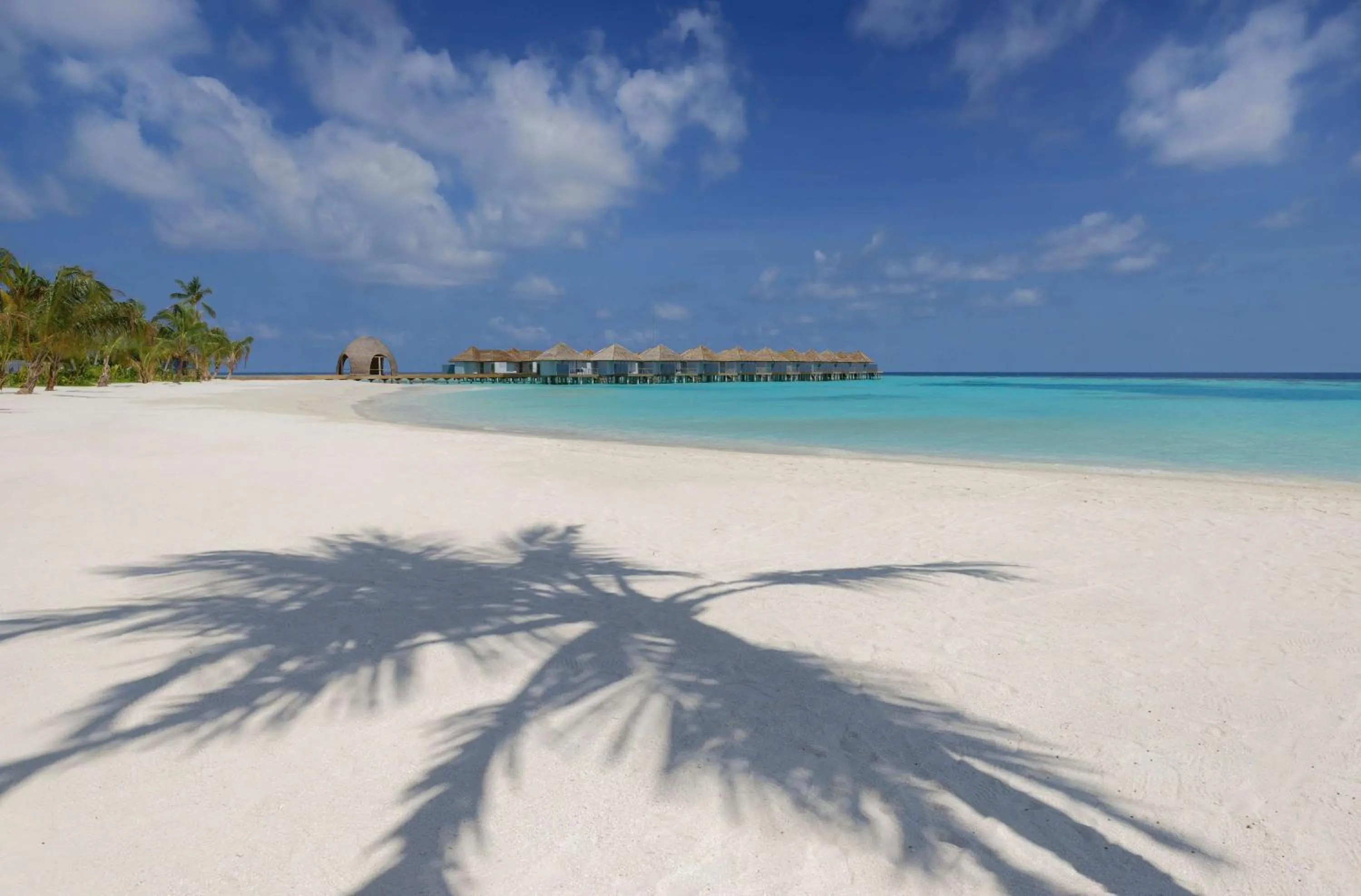 Beach in OUTRIGGER Maldives Maafushivaru Resort - 25 percent discount on transfers for min 4 nights stay and more, valid for reservations between 01 July till 22 Dec 2025