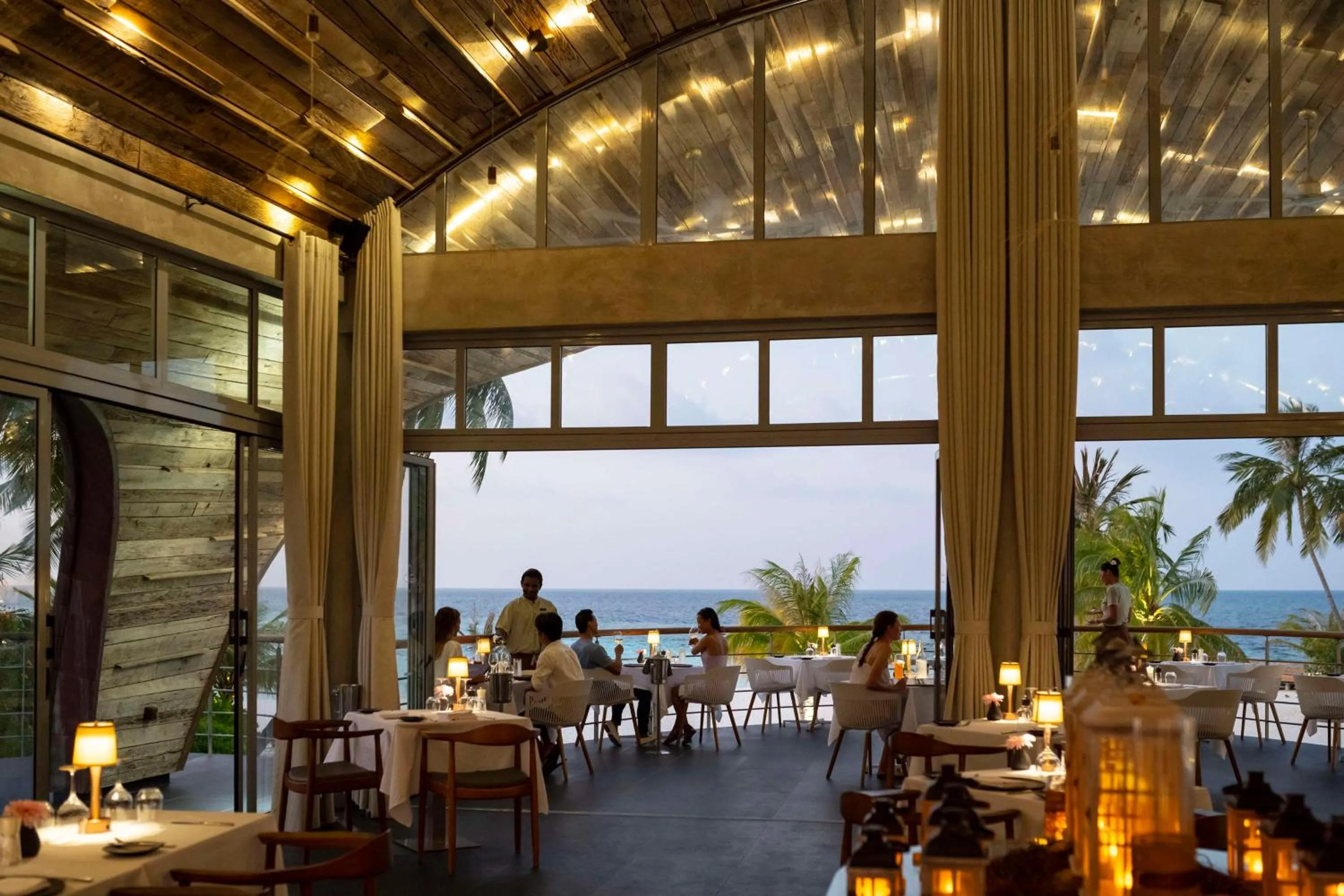 Restaurant/places to eat in OUTRIGGER Maldives Maafushivaru Resort - 25 percent discount on transfers for min 4 nights stay and more, valid for reservations between 01 July till 22 Dec 2025