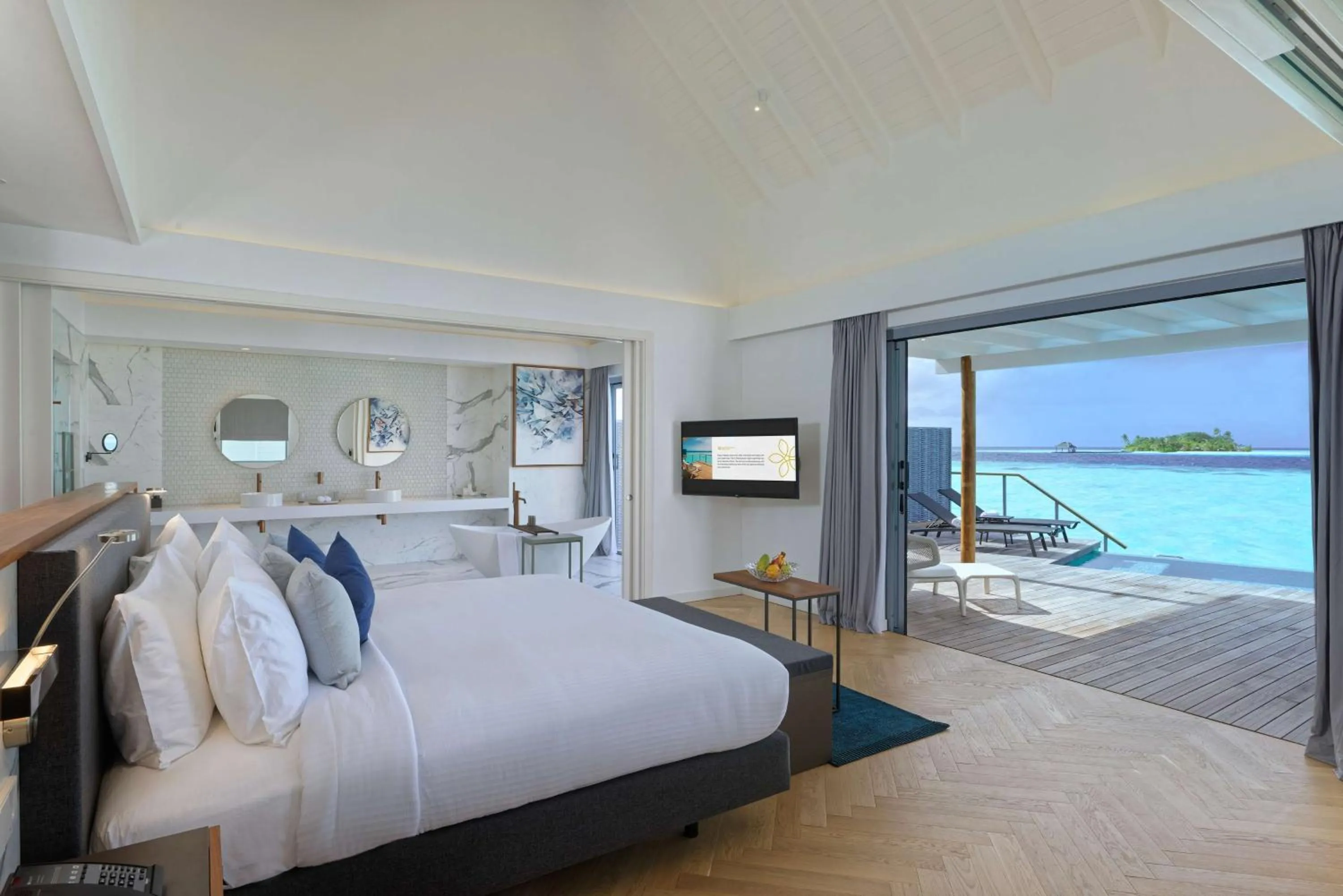 Photo of the whole room, Bed in OUTRIGGER Maldives Maafushivaru Resort - 25 percent discount on transfers for min 4 nights stay and more, valid for reservations between 01 July till 22 Dec 2025