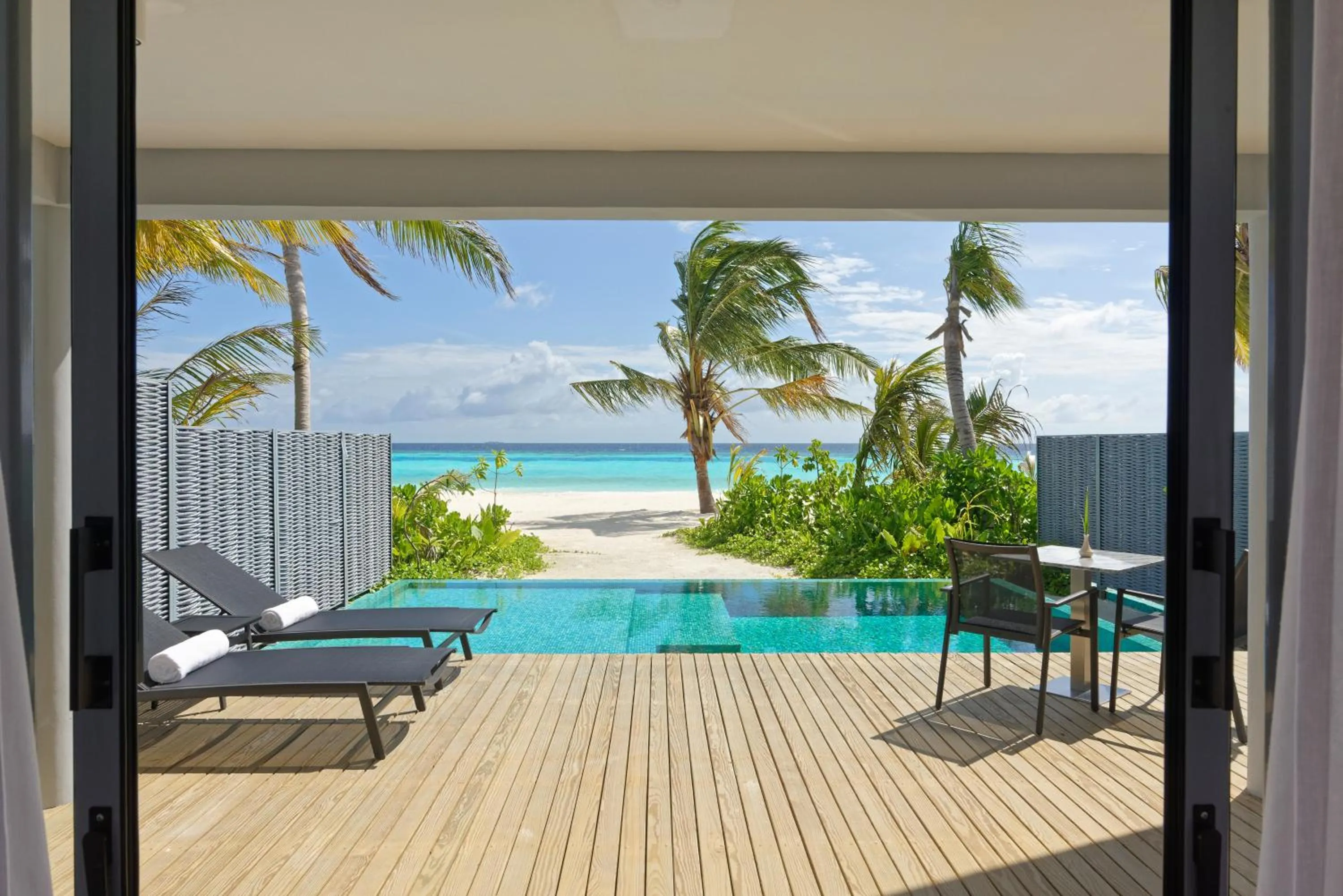 Balcony/Terrace in OUTRIGGER Maldives Maafushivaru Resort - 25 percent discount on transfers for min 4 nights stay and more, valid for reservations between 01 July till 22 Dec 2025