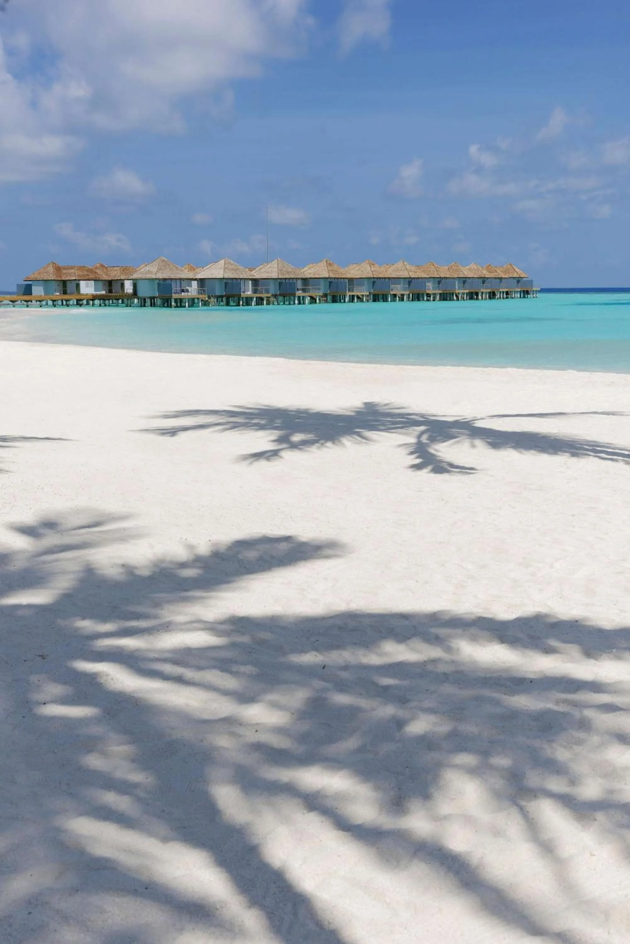 Beach in OUTRIGGER Maldives Maafushivaru Resort - 25 percent discount on transfers for min 4 nights stay and more, valid for reservations between 01 July till 22 Dec 2025