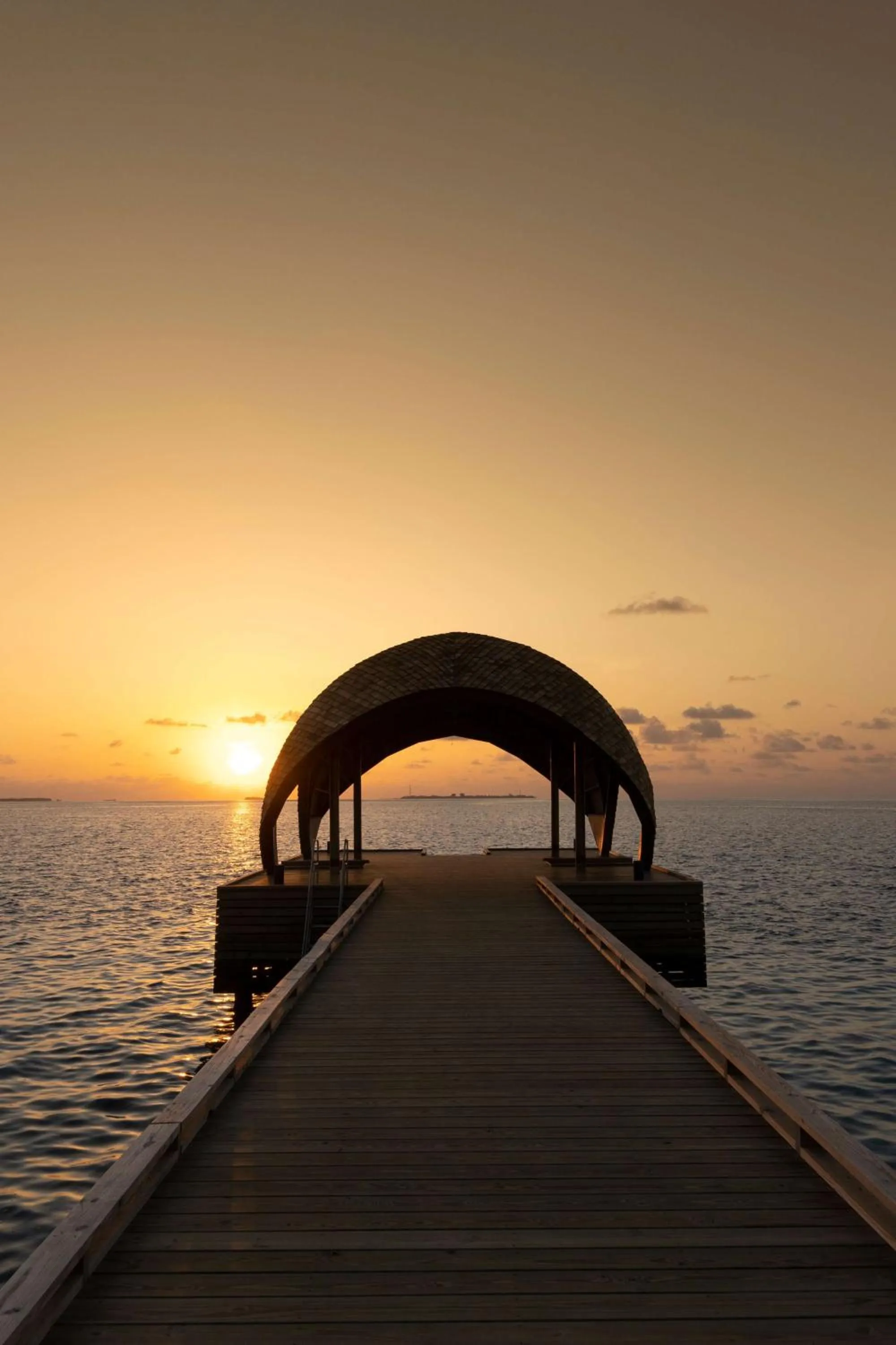 Property building in OUTRIGGER Maldives Maafushivaru Resort - 25 percent discount on transfers for min 4 nights stay and more, valid for reservations between 01 July till 22 Dec 2025