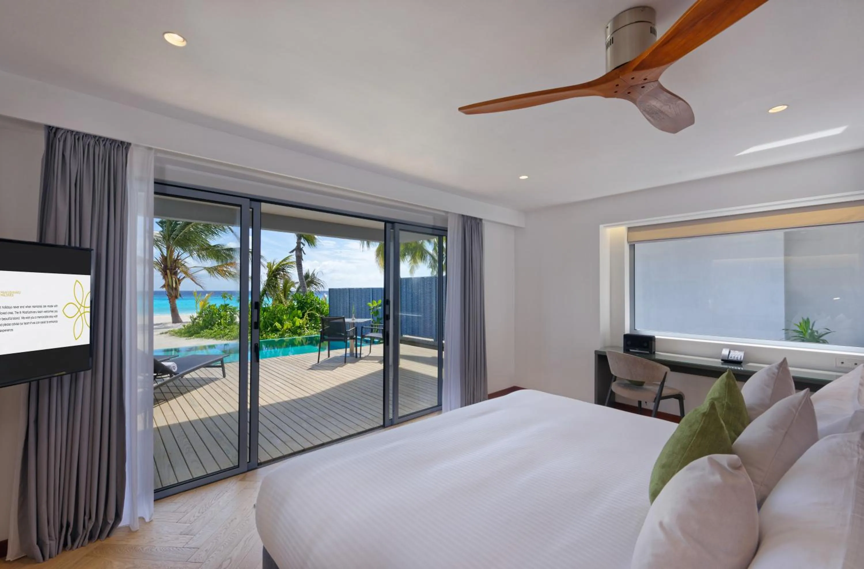 Balcony/Terrace, Bed in OUTRIGGER Maldives Maafushivaru Resort - 25 percent discount on transfers for min 4 nights stay and more, valid for reservations between 01 July till 22 Dec 2025