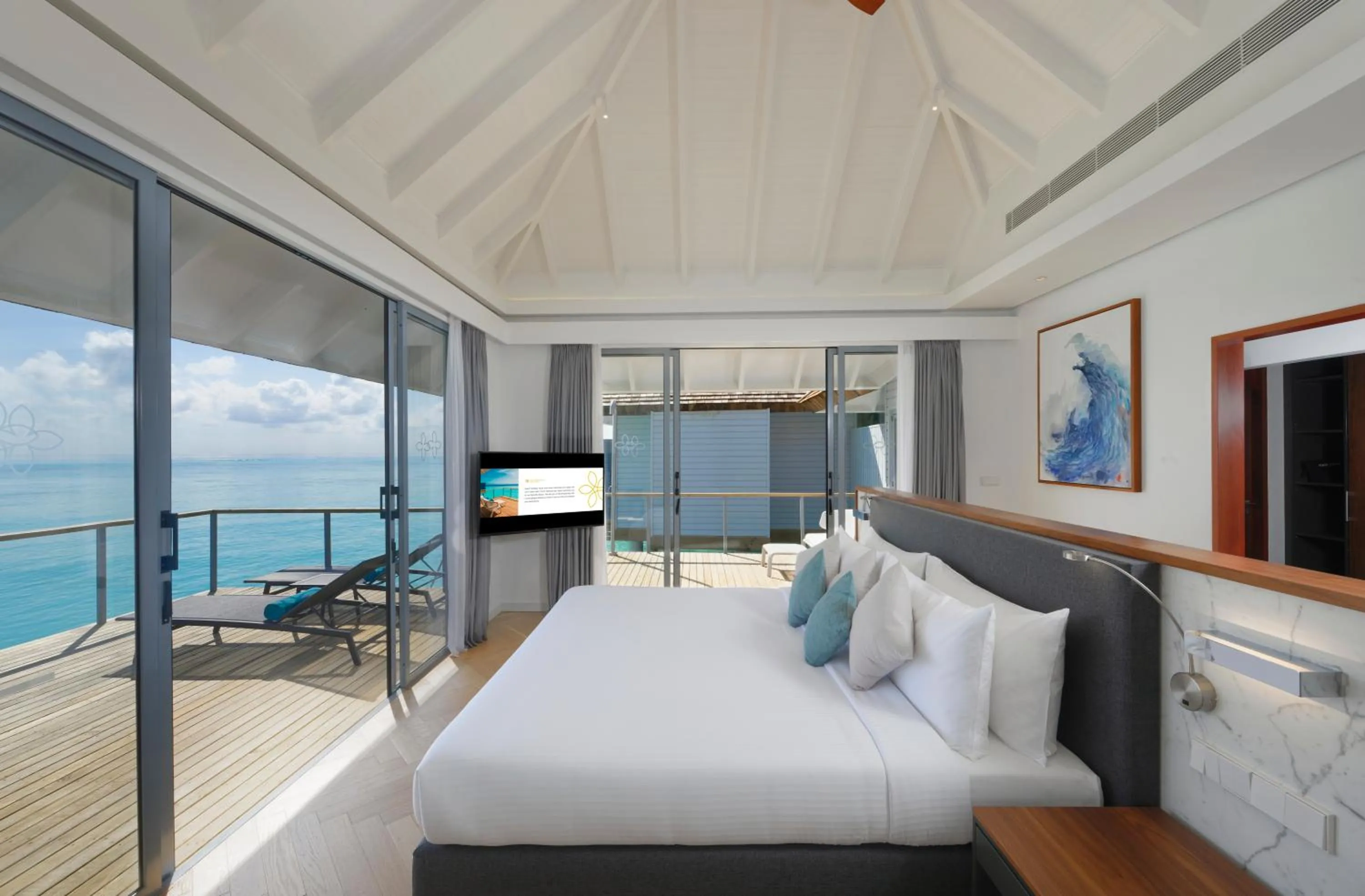 Balcony/Terrace, Bed in OUTRIGGER Maldives Maafushivaru Resort - 25 percent discount on transfers for min 4 nights stay and more, valid for reservations between 01 July till 22 Dec 2025