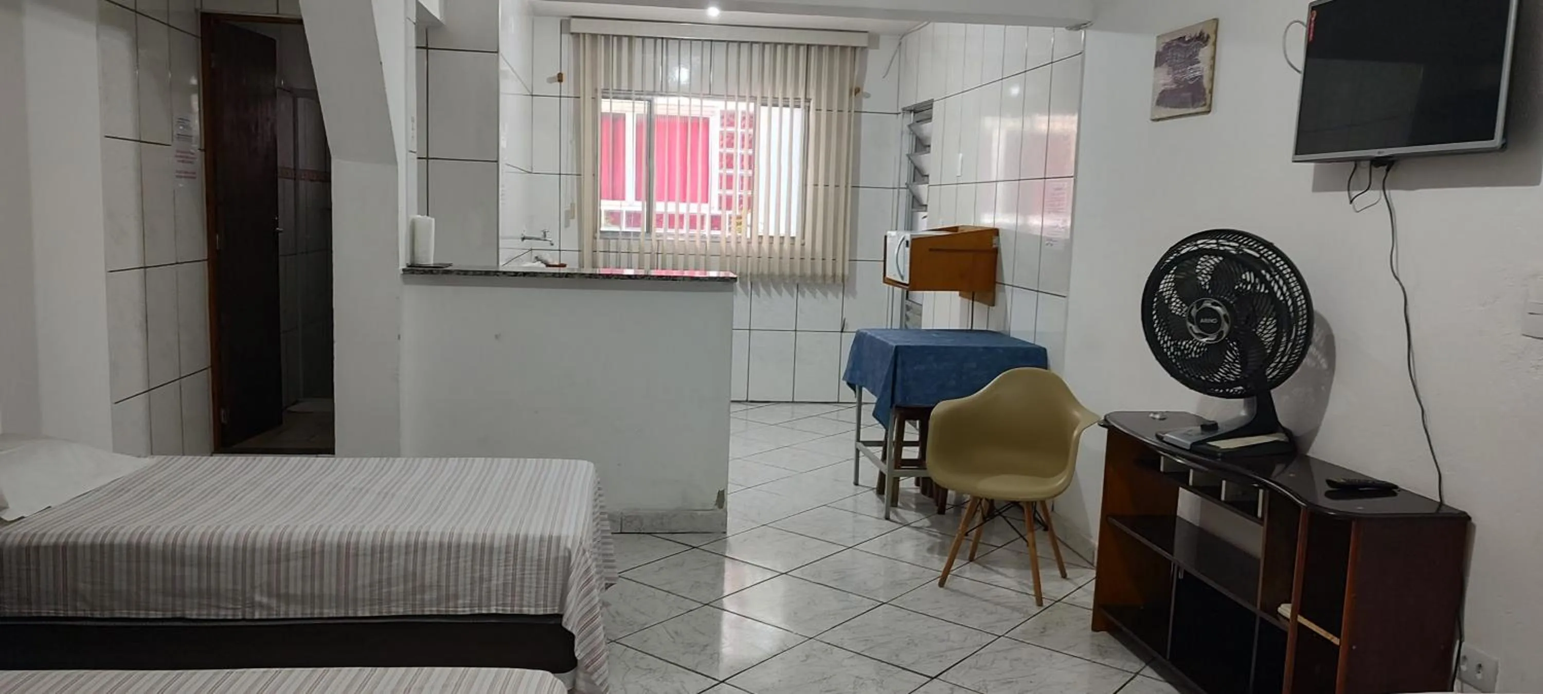 Bed in Pousada Guarulhos