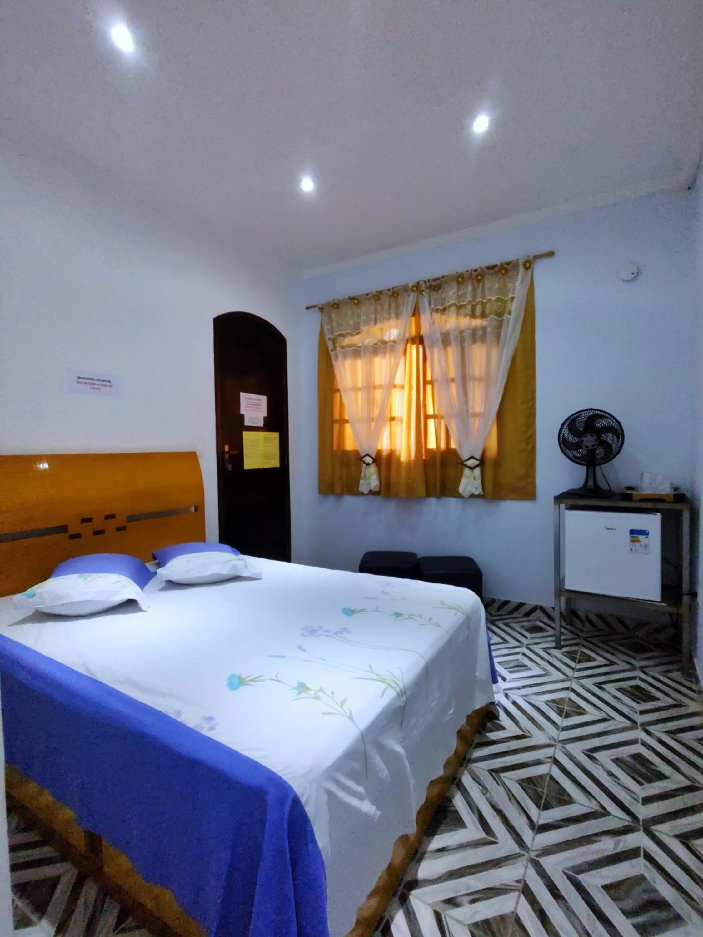 Bed in Pousada Guarulhos