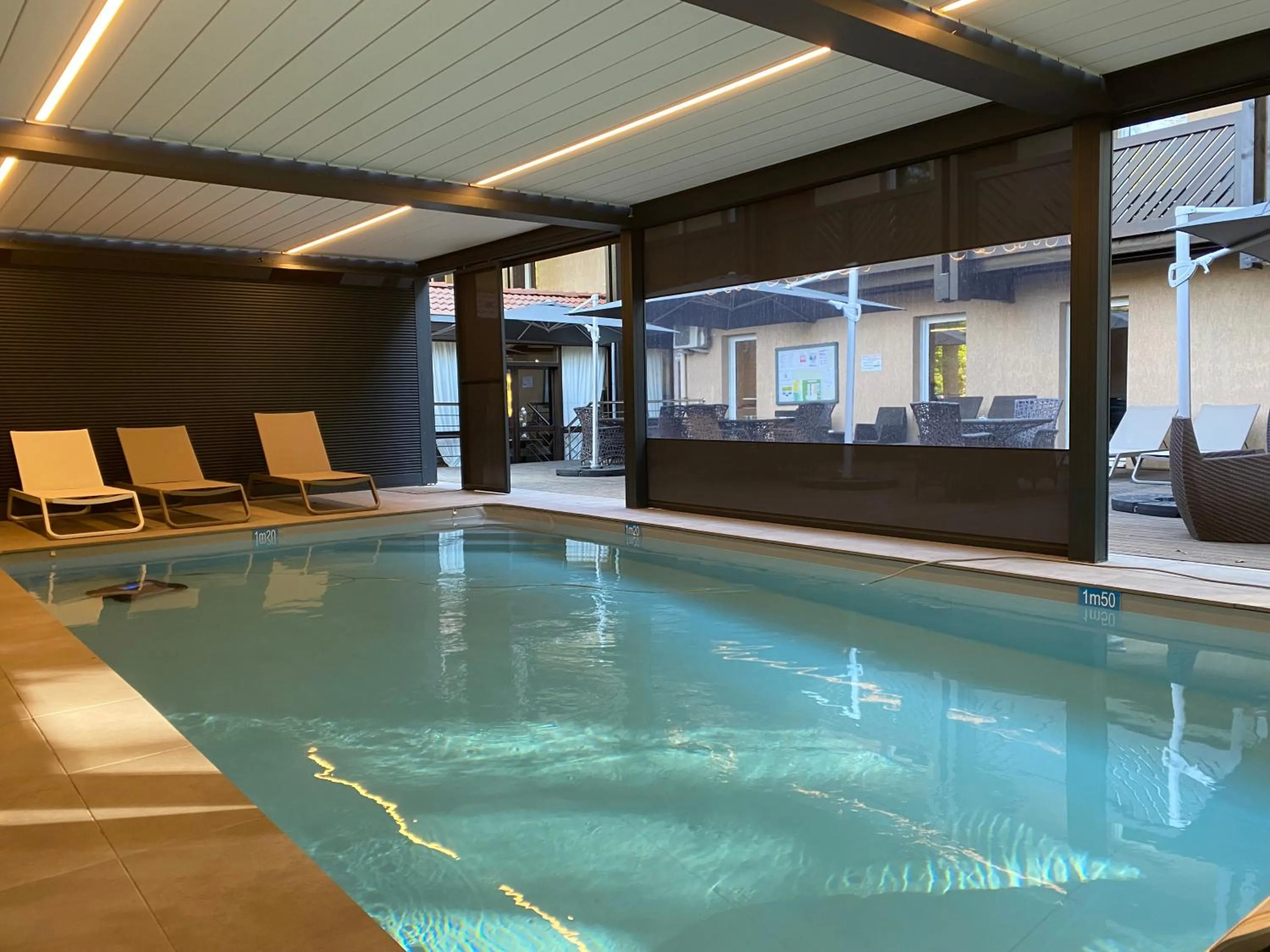 Swimming pool in Enzo Hôtels Diane - Logis Amnéville