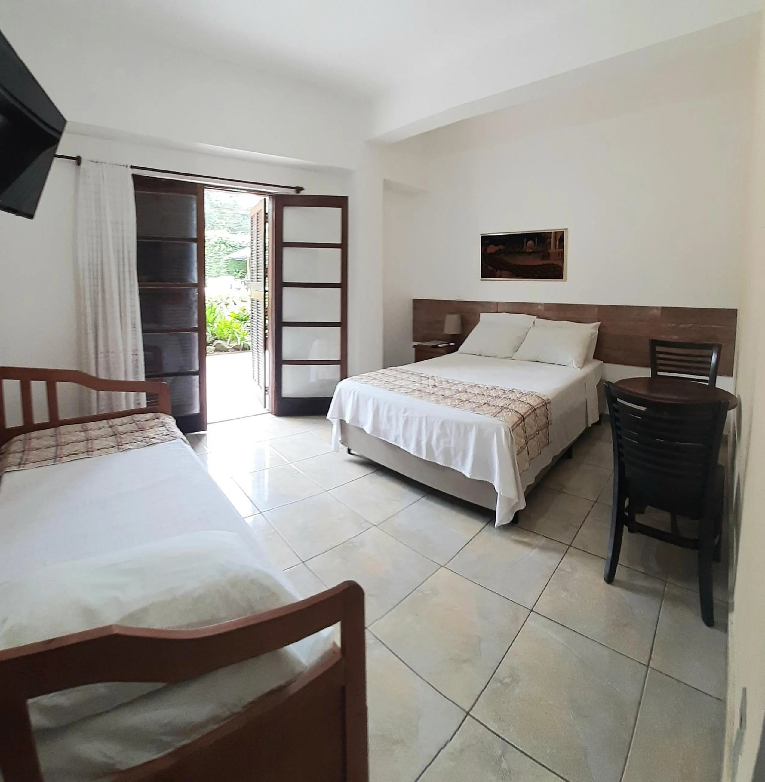 Bed in Pousada Mari
