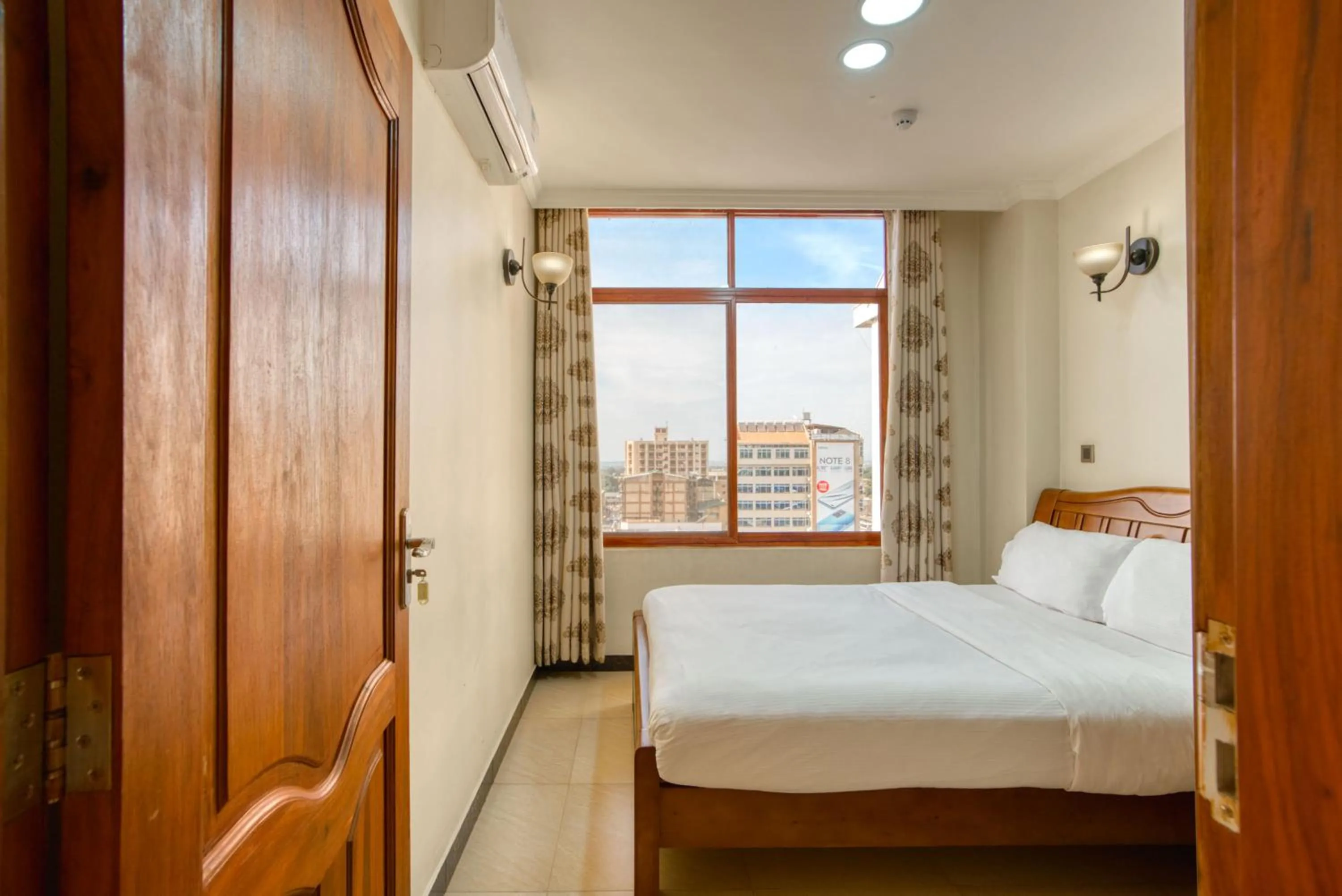 Bed in Kibo Palace Apartments