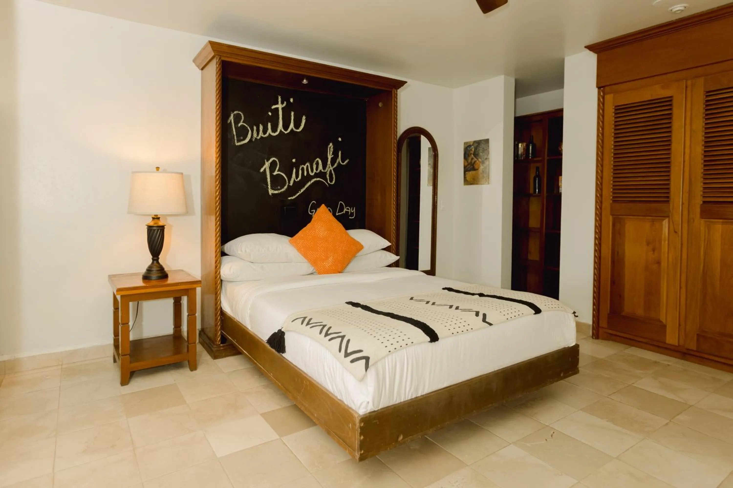 Bed in Almond Beach Resort at Jaguar Reef