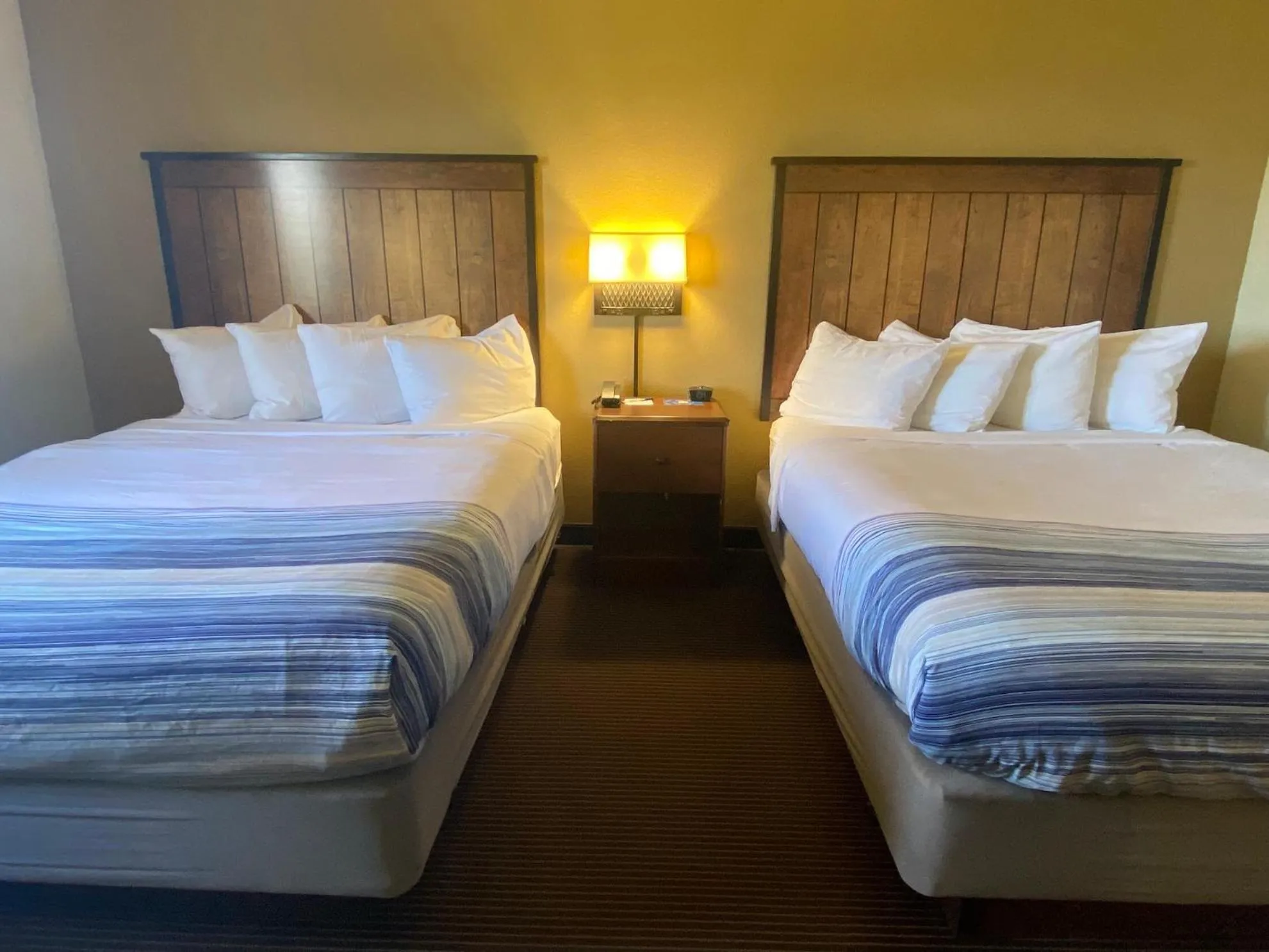 Bed in AmericInn by Wyndham Two Harbors Near Lake Superior