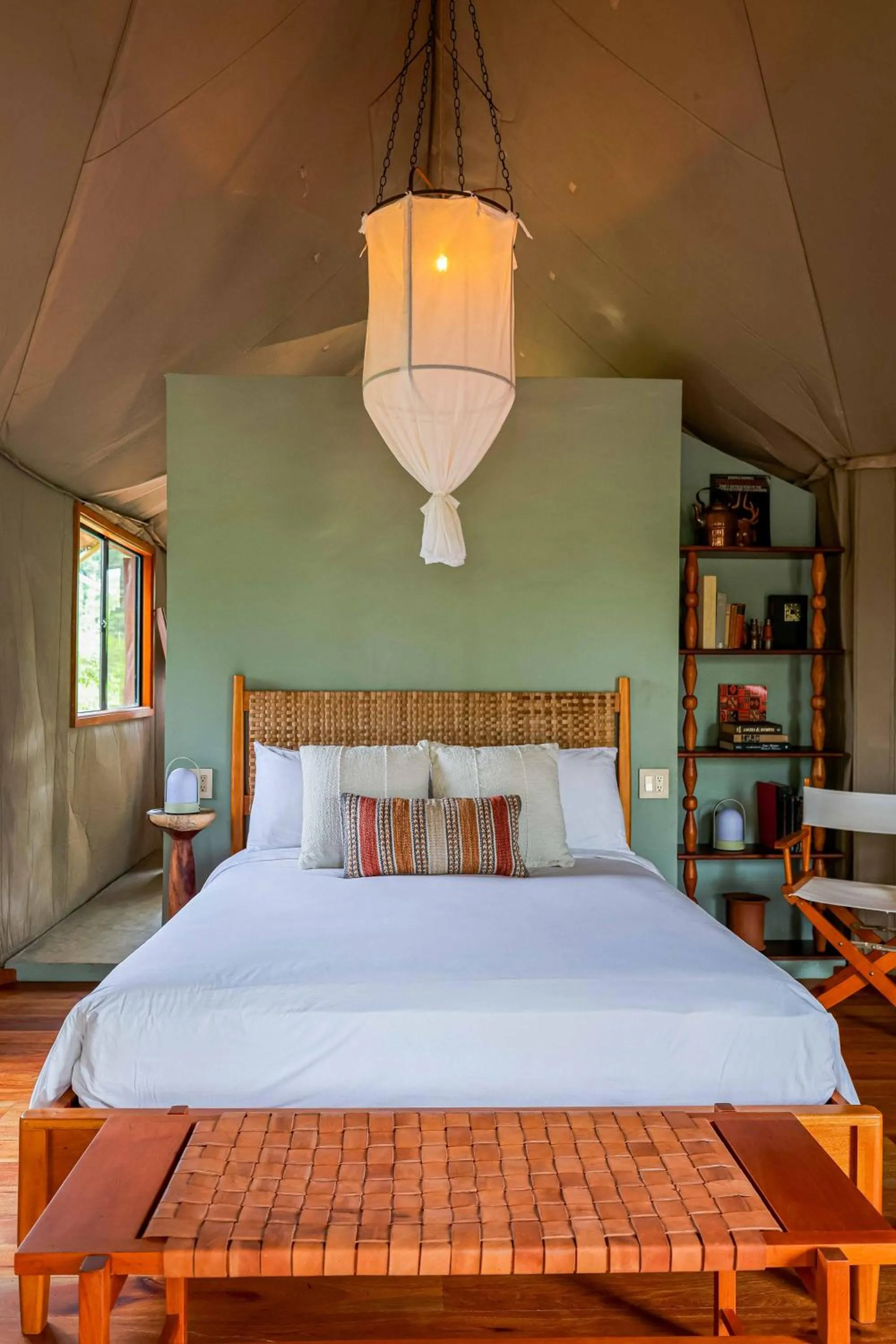 Bed in Sleeping Giant Rainforest Lodge