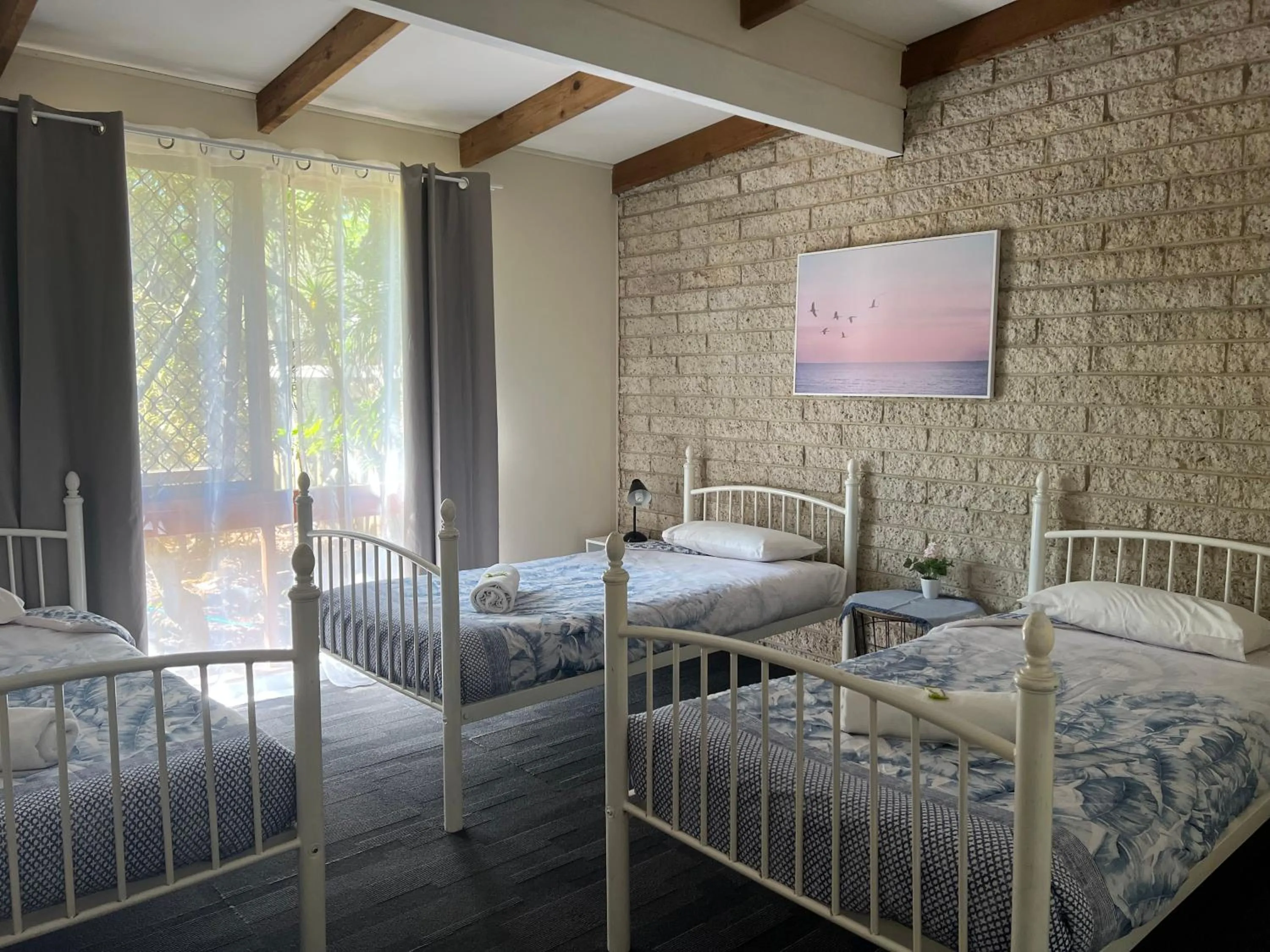 Bed in Colonial Village Resort