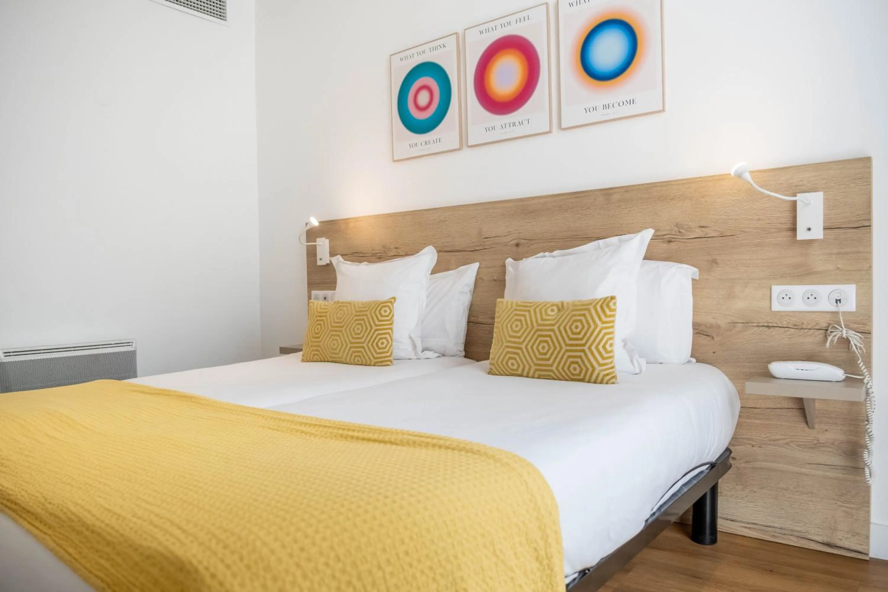 Bed in Hôtel de la Fontaine