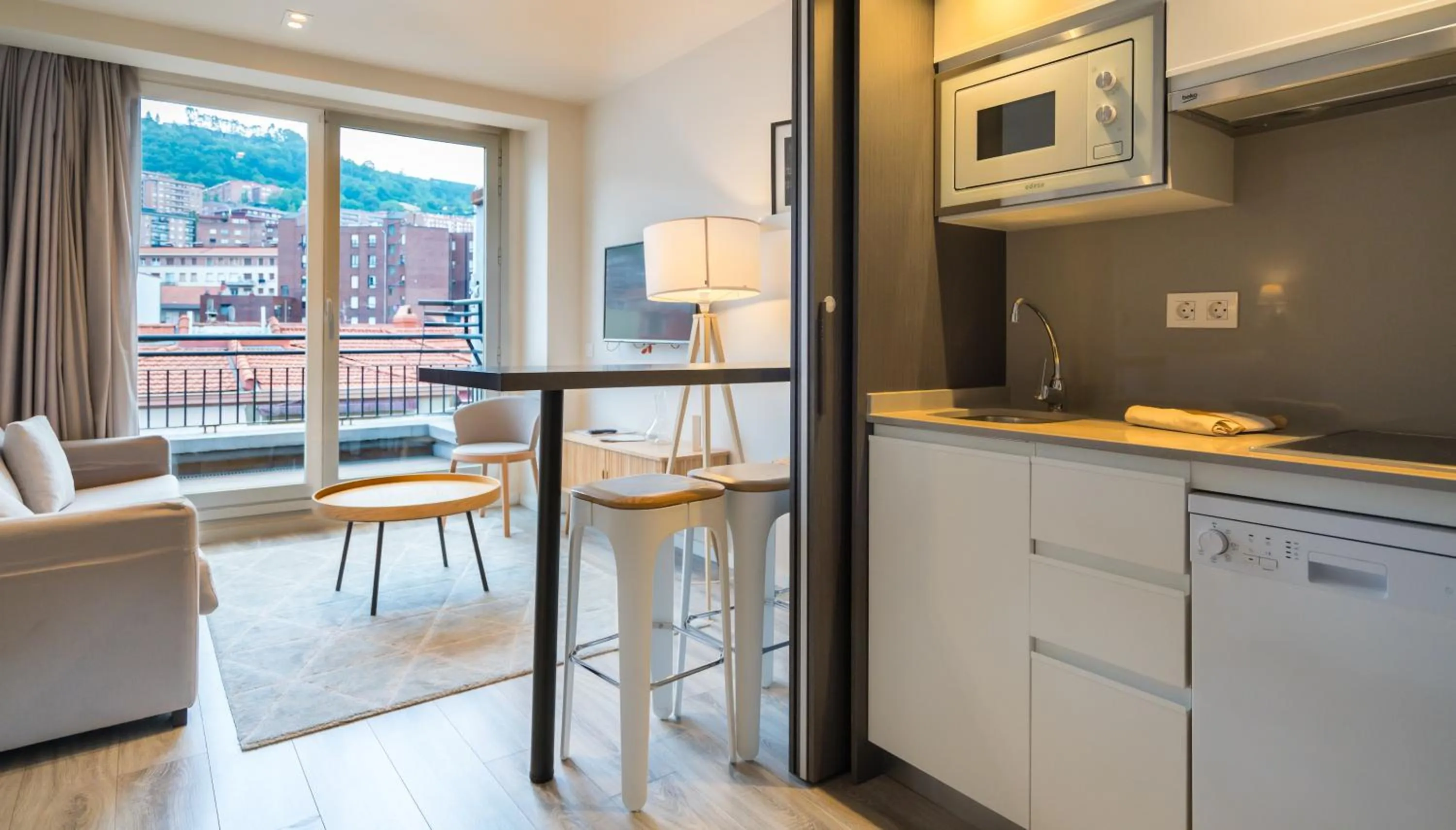 Kitchen or kitchenette in Bilbao City Center by abba Suites