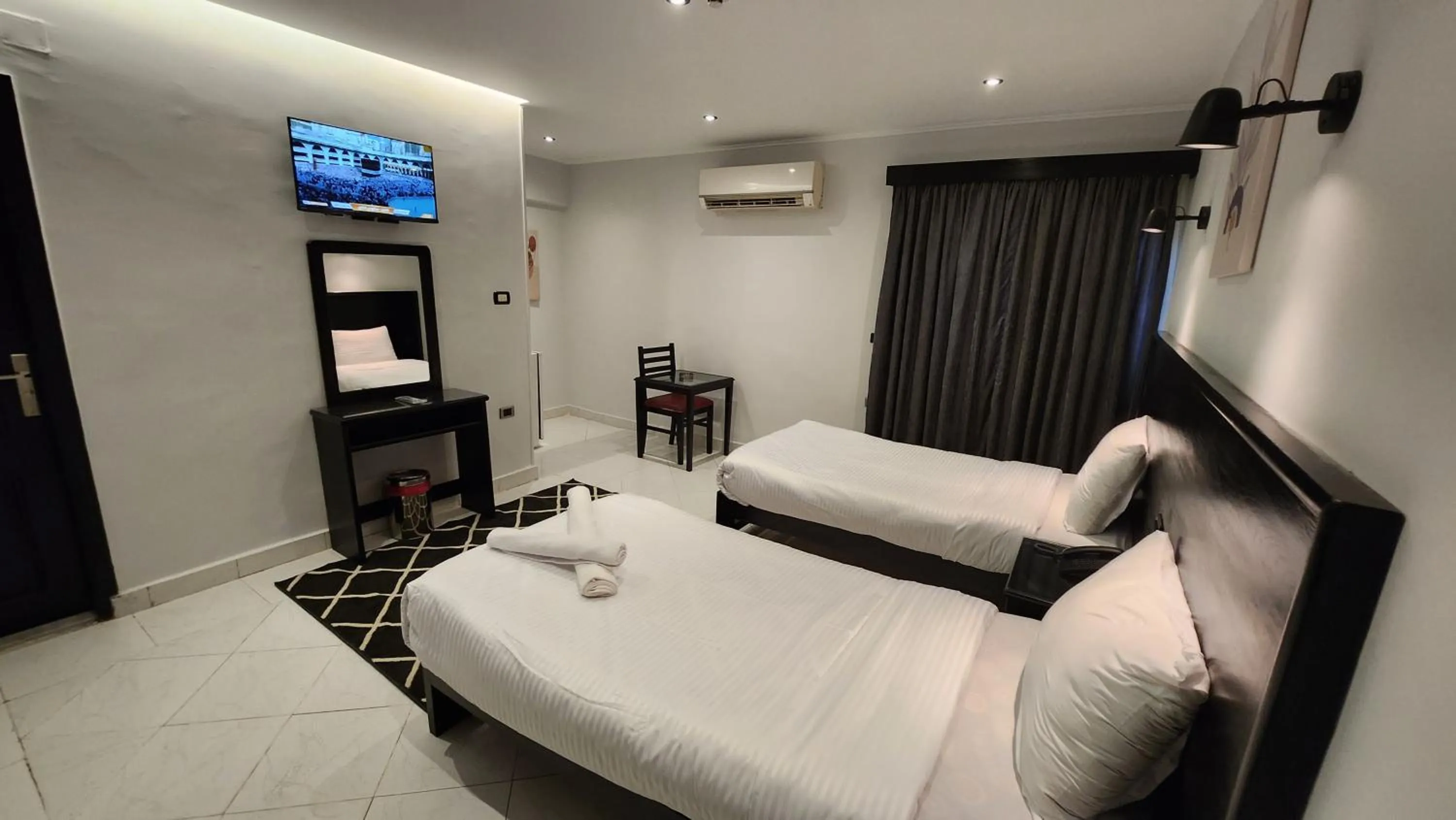 Bed in Helio Cairo Hotel