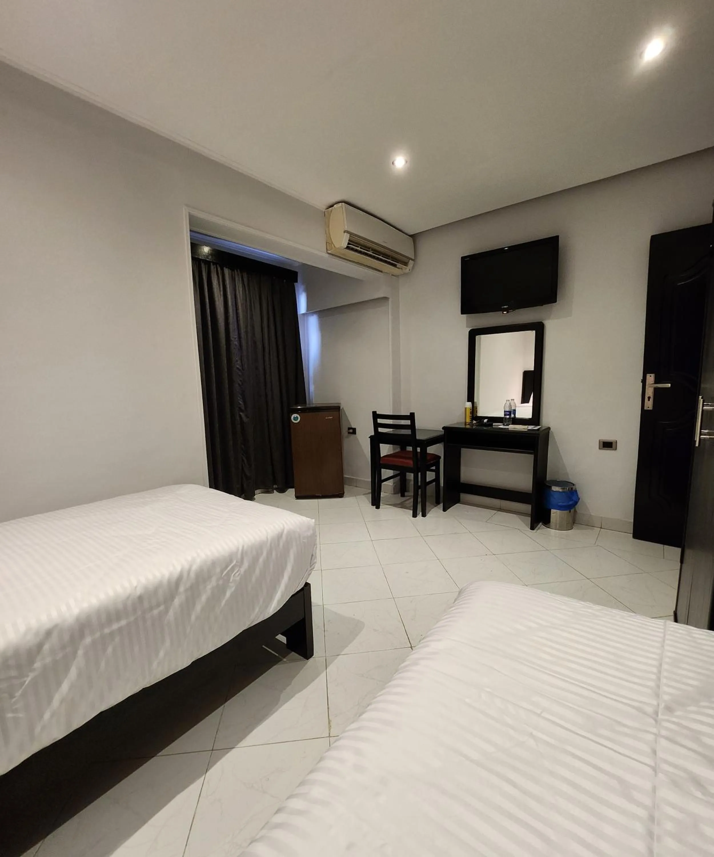 Bed in Helio Cairo Hotel